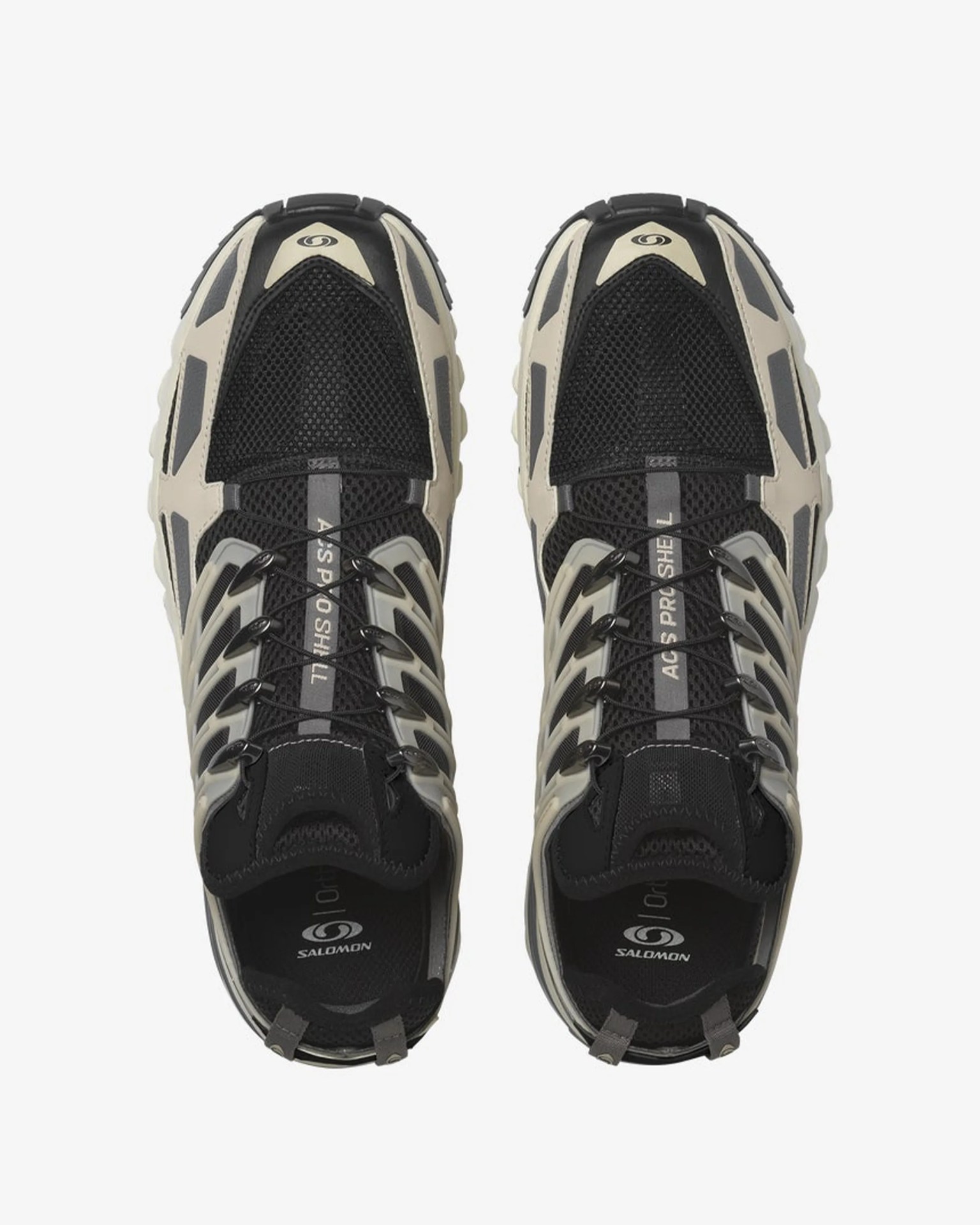 Pair of black and beige Salomon trail running shoes with mesh upper and quick-lace system, viewed from above.