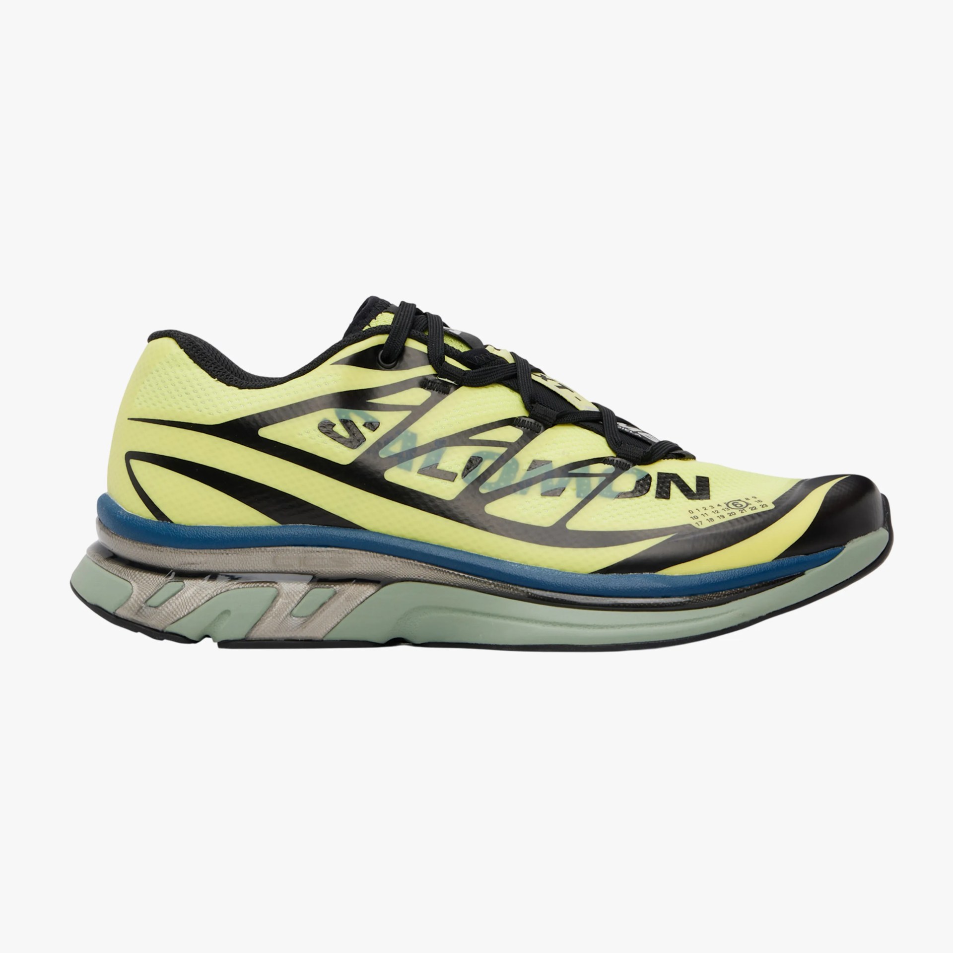 Yellow and black Salomon running shoe with blue and gray sole viewed from the side.
