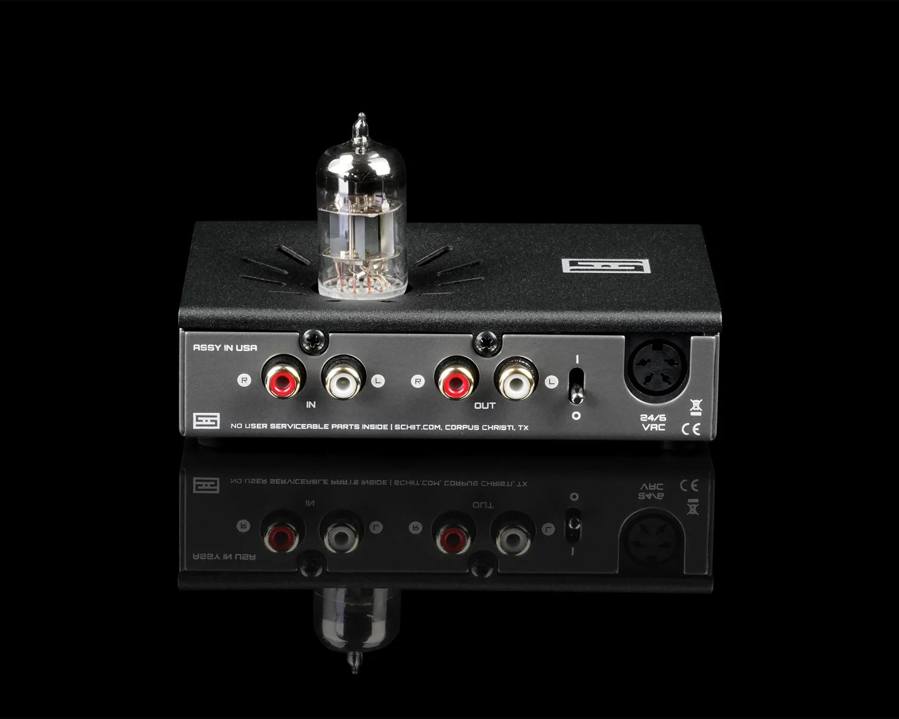 Black Schiit audio device with a vacuum tube on top and RCA input/output ports on the front panel.
