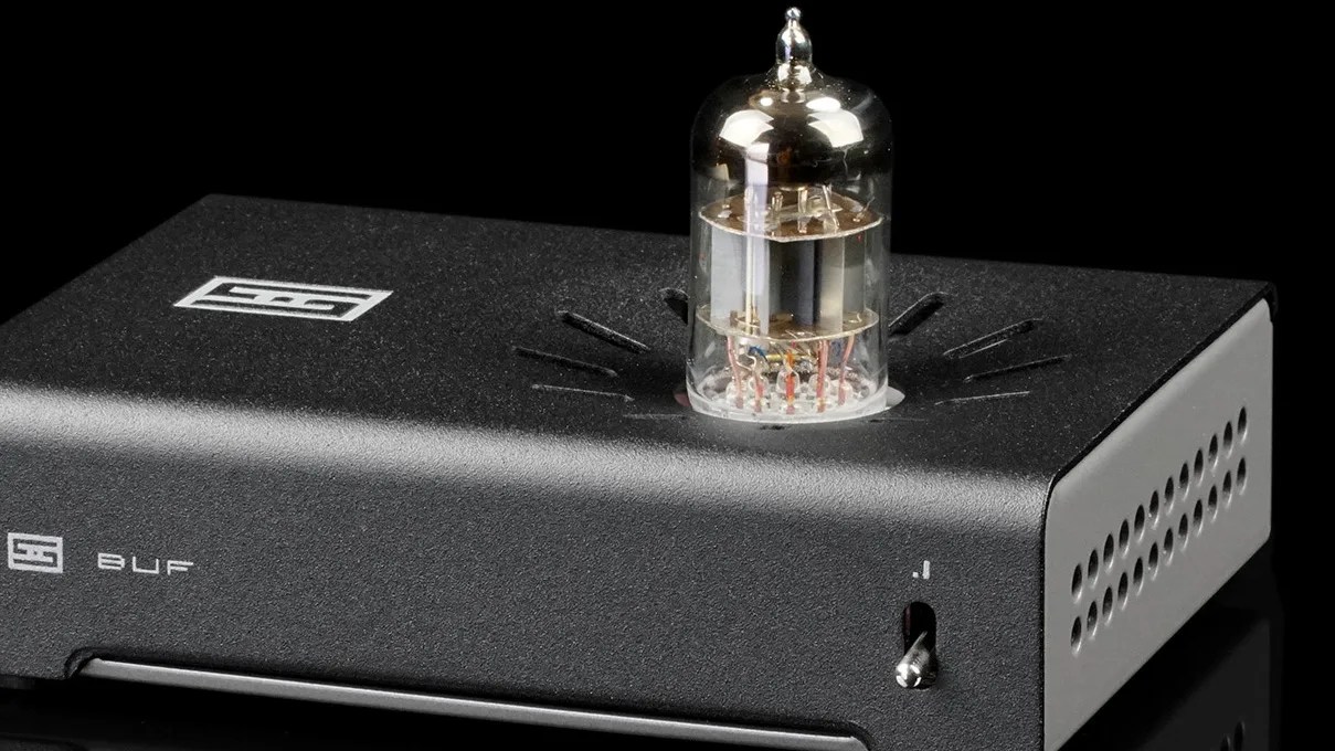 Black rectangular audio amplifier with a glass vacuum tube on top and ventilation holes on the side.
