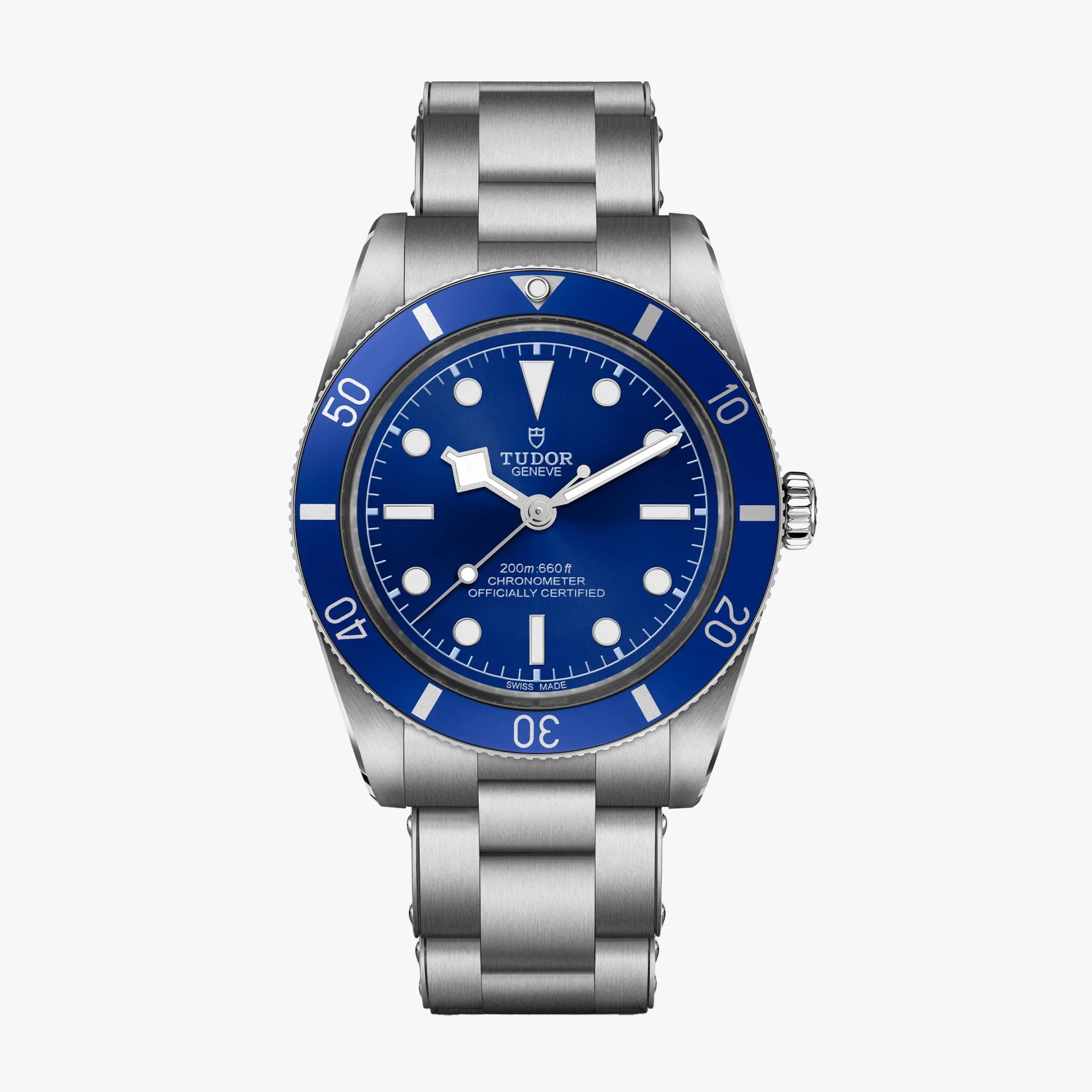 Stainless steel Tudor dive watch with blue bezel and dial, luminous markers, and metal bracelet.