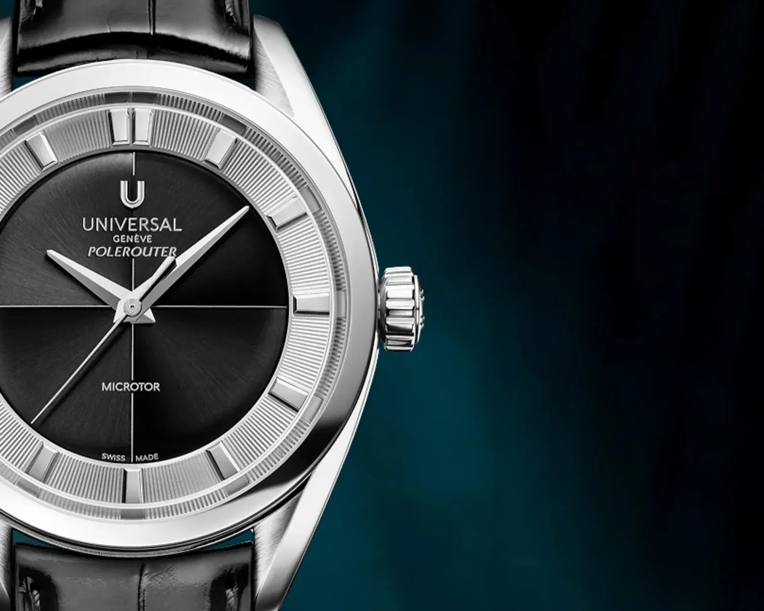 Close-up of a Universal Gen&egrave;ve Polerouter Microtor watch with a black dial, silver markers, and a black leather strap.