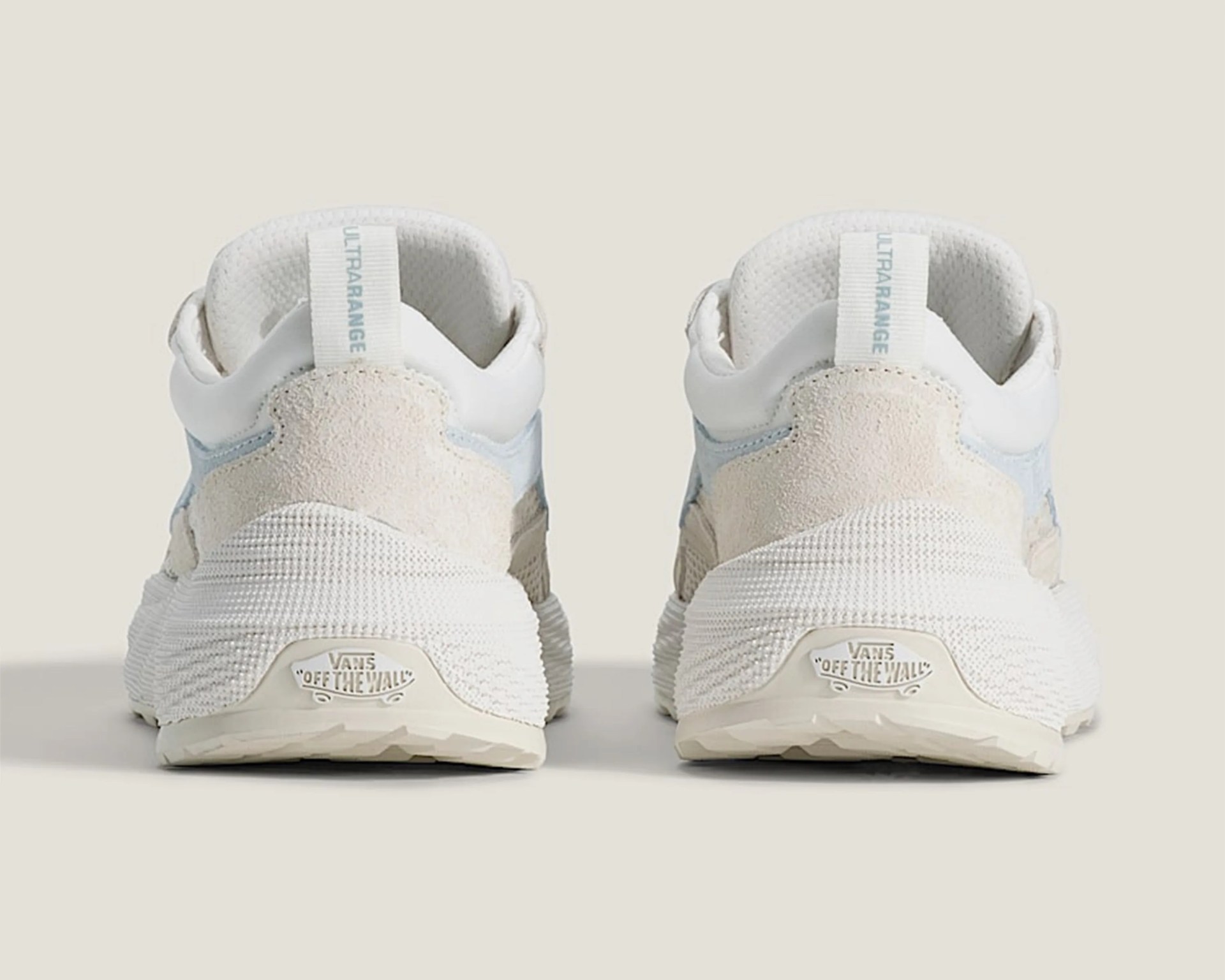 Pair of white Vans Ultrarange sneakers shown from the back with textured midsoles and "Off The Wall" logos.