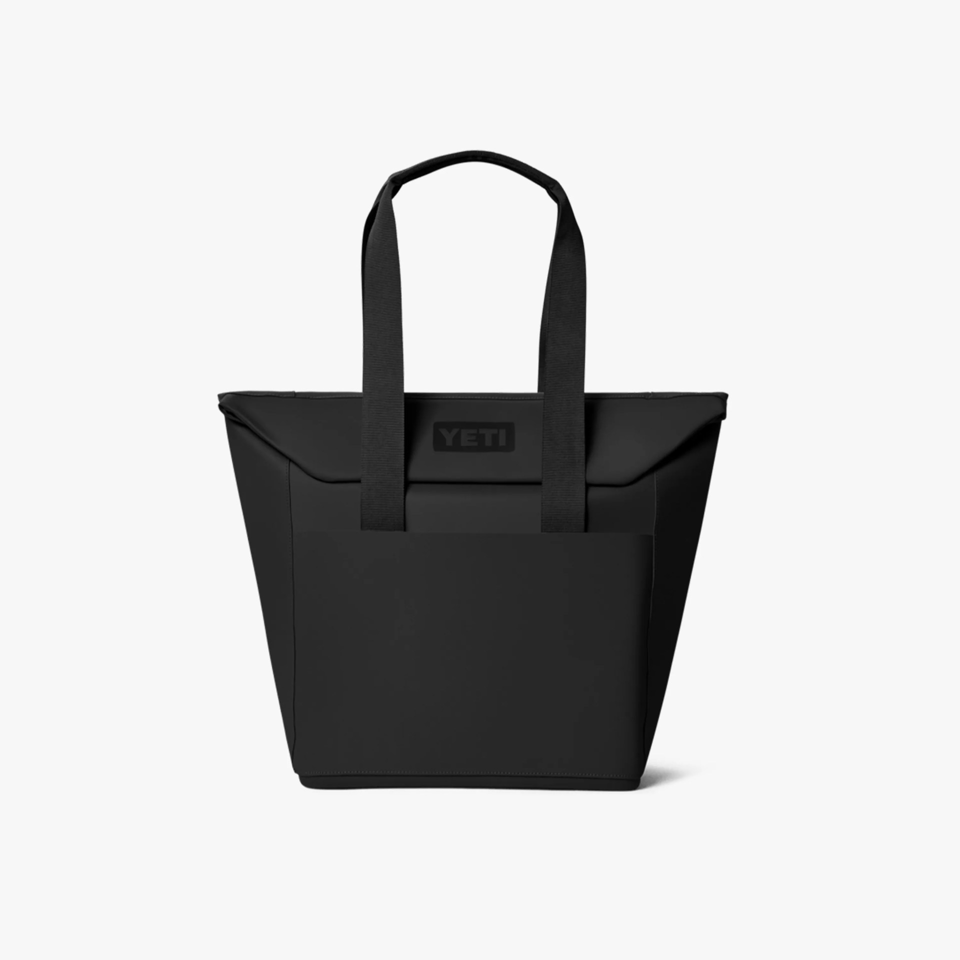 Black YETI tote bag with wide fabric handles and a front pocket.
