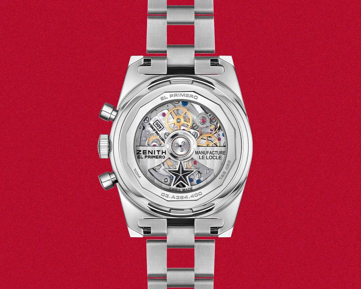 Back view of a Zenith El Primero watch showing the mechanical movement through a transparent caseback on a red background.