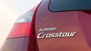 Close-up of red Honda Accord Crosstour rear with chrome badges and taillight.