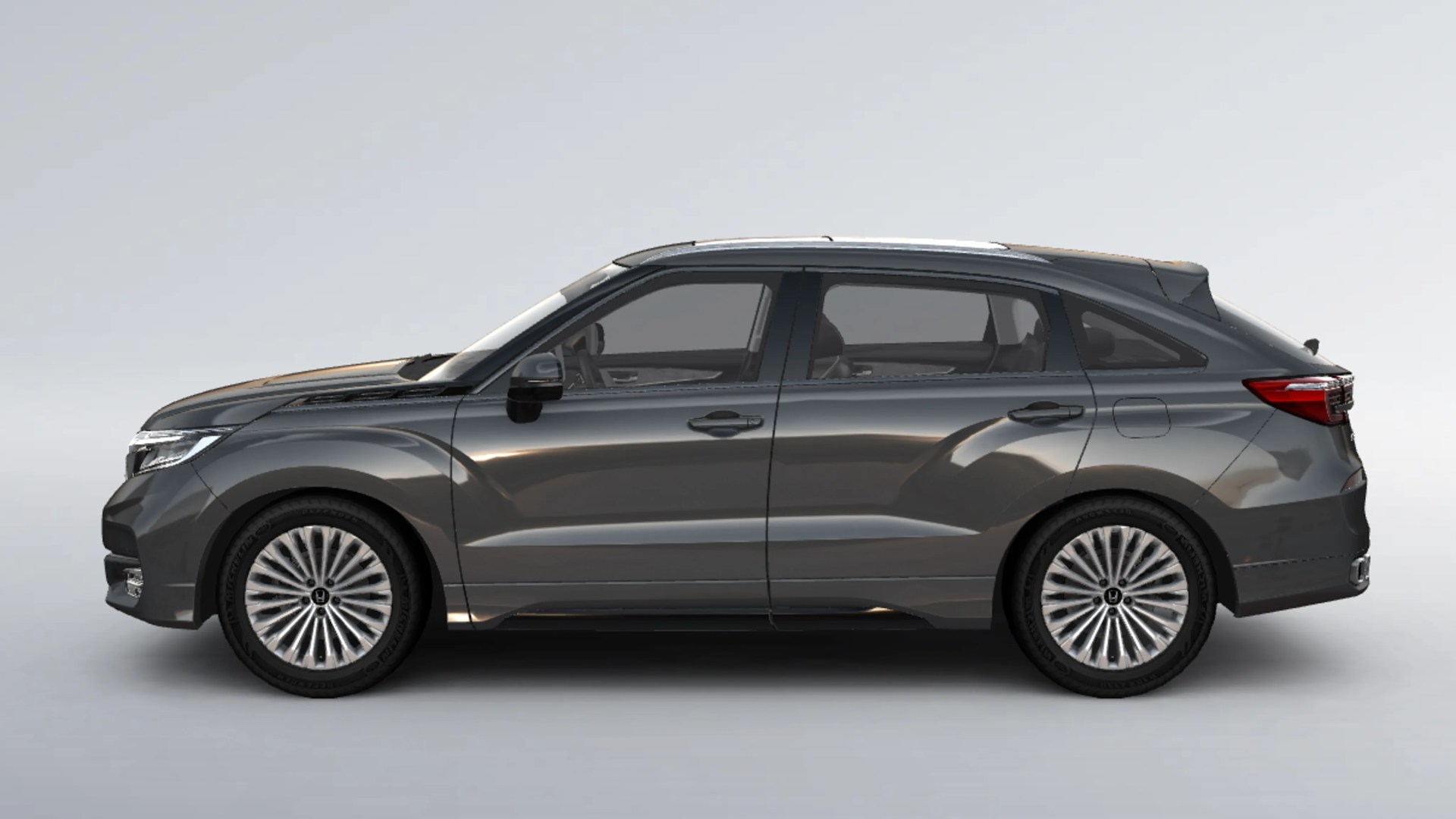 Dark gray modern compact SUV with multi-spoke alloy wheels shown in profile.