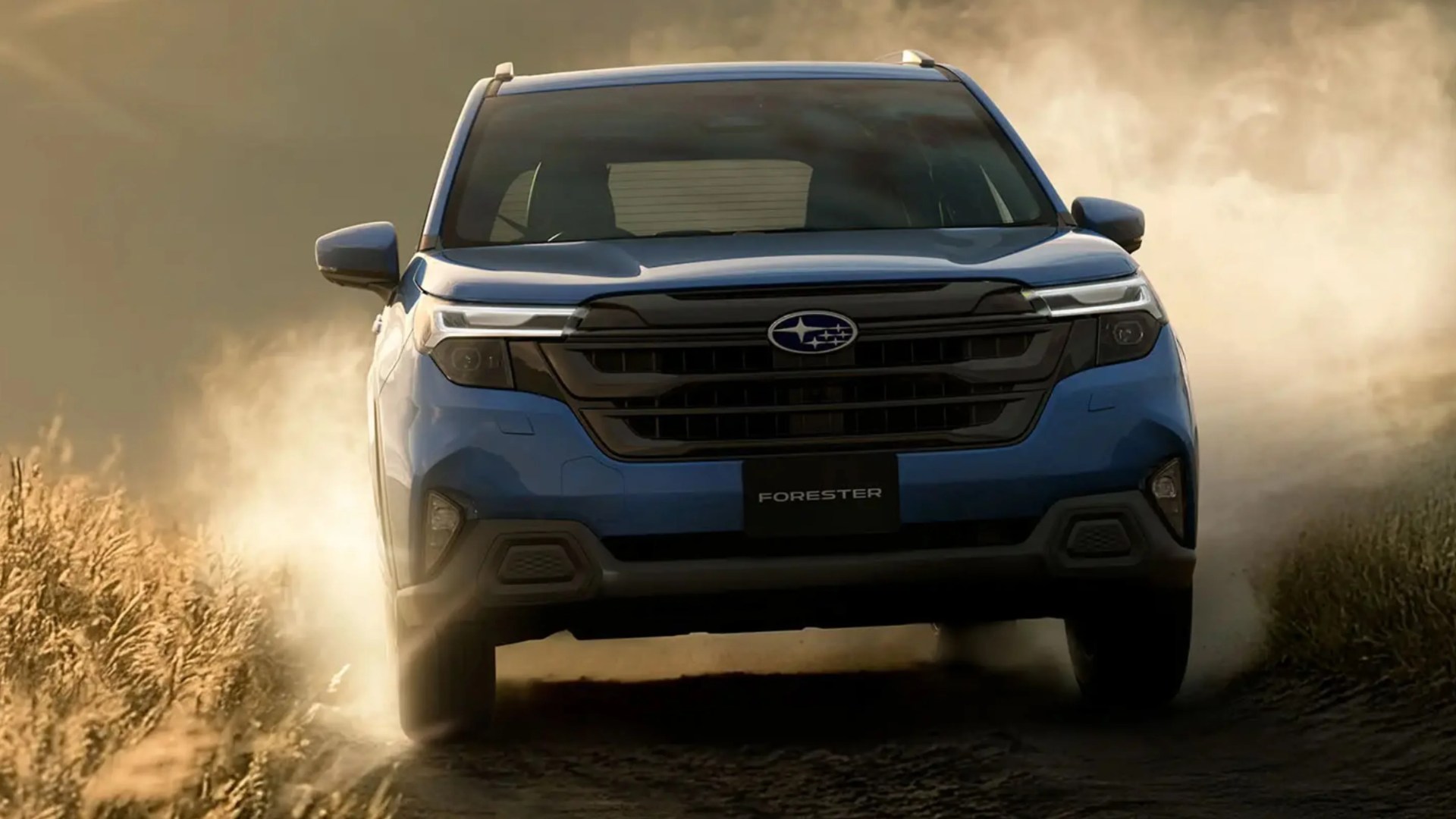 Blue Subaru Forester SUV kicking up dust on a dirt road at sunset.