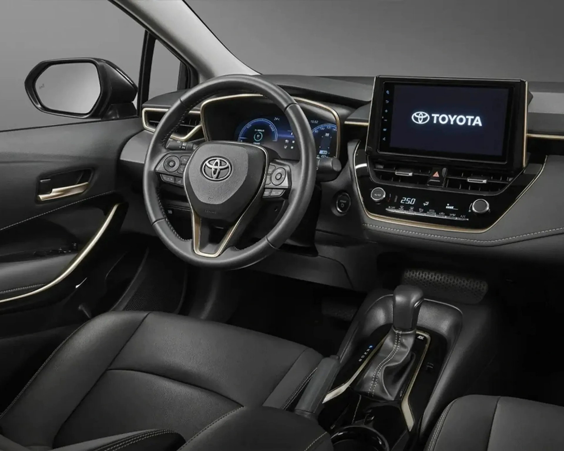 Black leather interior of a Toyota car with a digital dashboard, touchscreen display, and automatic gear shift.