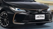 Front view of a black Toyota Corolla Altis with LED headlights and bronze trim accents.