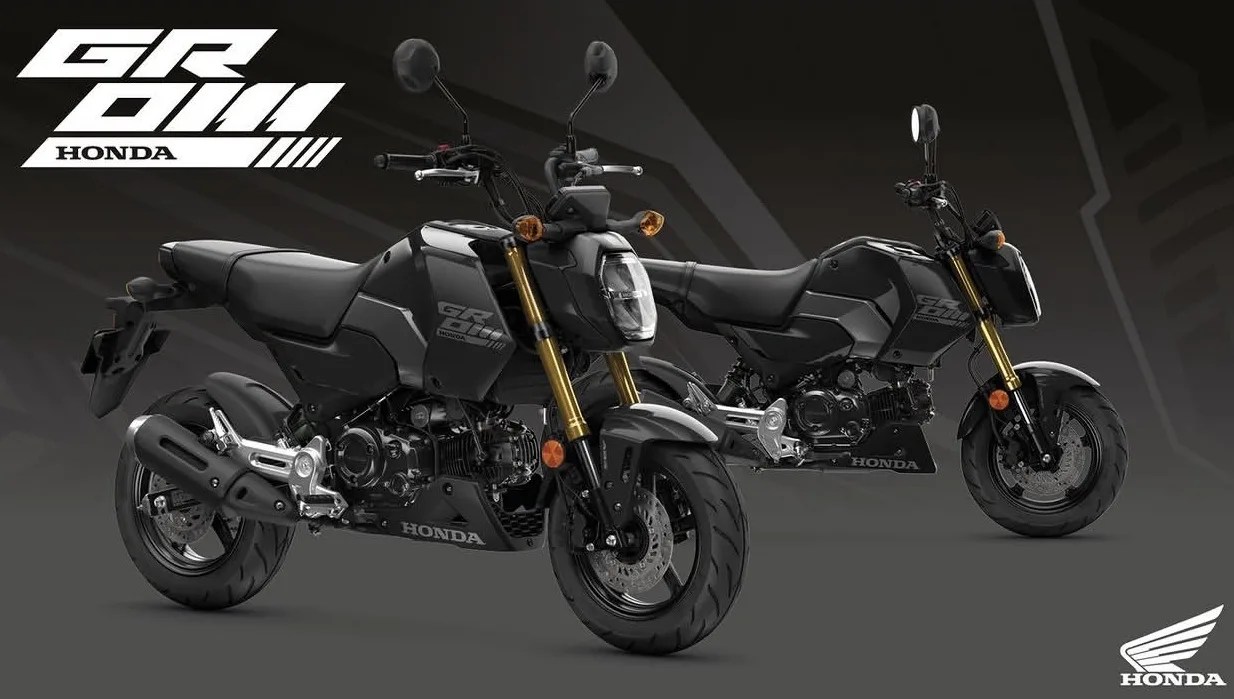 Two black Honda Grom motorcycles with gold front forks on a dark gray background with Honda logos.