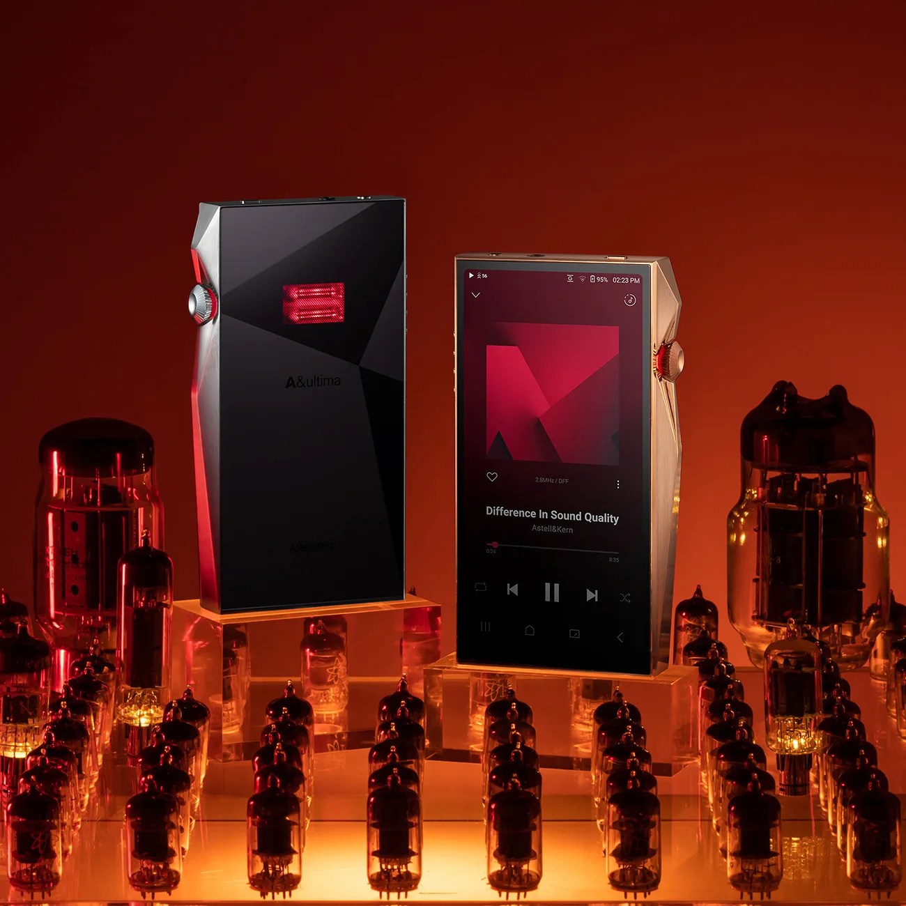 Two sleek digital music players with angular designs, one black and one gold, displayed on clear stands surrounded by glowing vacuum tubes.