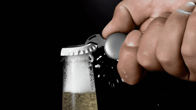 tiny mulit-tool opening a beer