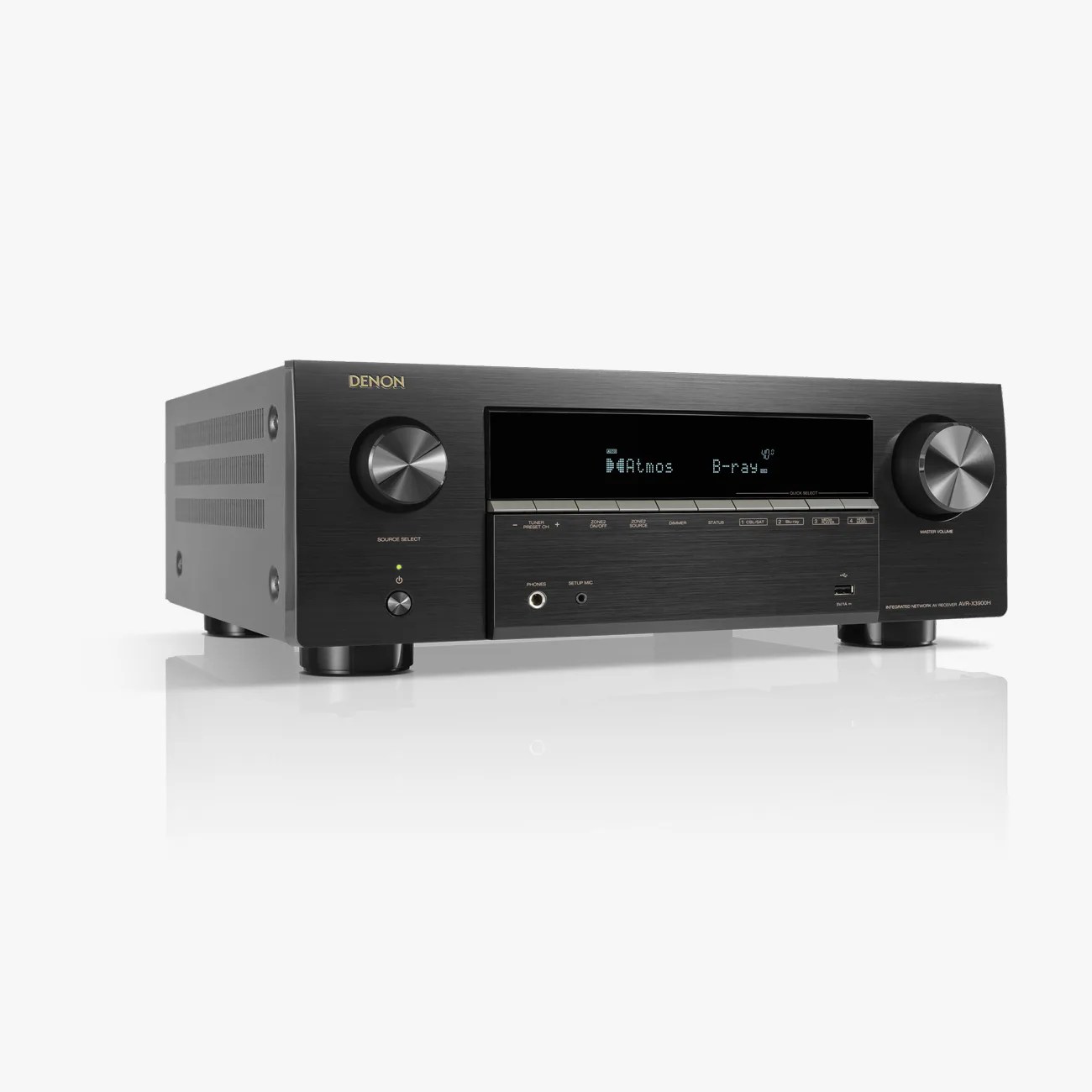 Black Denon AVR-X3900H integrated network AV receiver with digital display and control knobs on a white reflective surface.