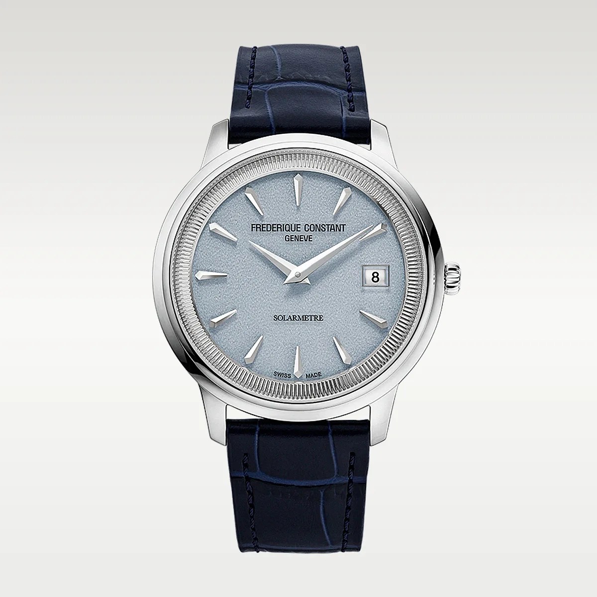 Silver round watch with textured light blue dial, silver hour markers, date window, and dark blue leather strap.