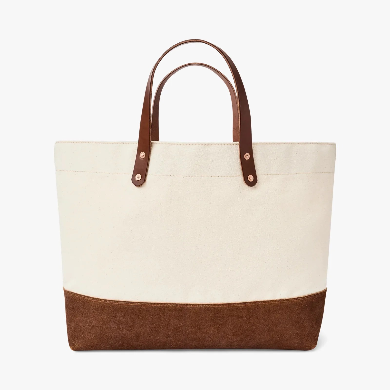 Beige canvas tote bag with brown suede bottom and brown leather handles.