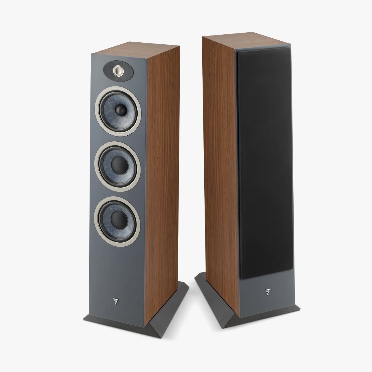 Pair of floor-standing speakers with walnut wood sides, gray front panels, and black speaker covers on one.