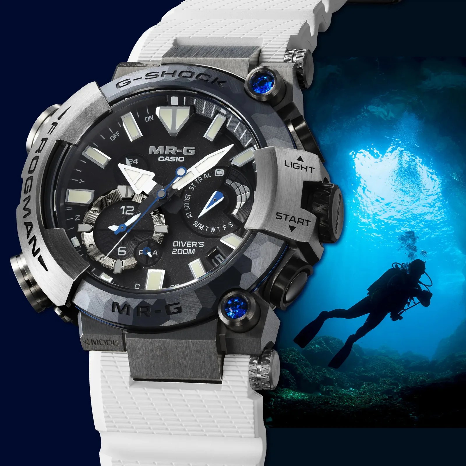 Close-up of a Casio G-Shock MR-G Frogman diver's watch with a white strap and blue accent stones, next to a silhouette of a scuba diver underwater.