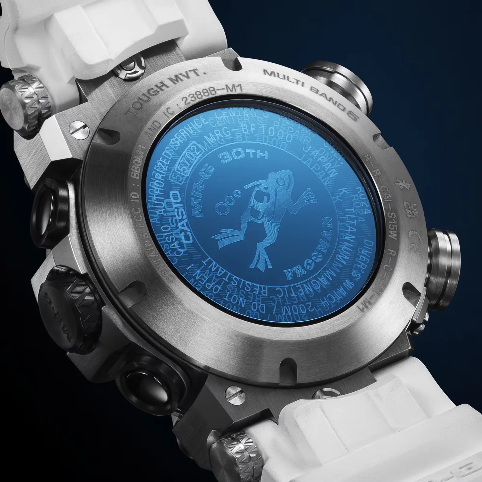Close-up of the back of a Casio G-Shock Frogman watch with a blue emblem and white strap.