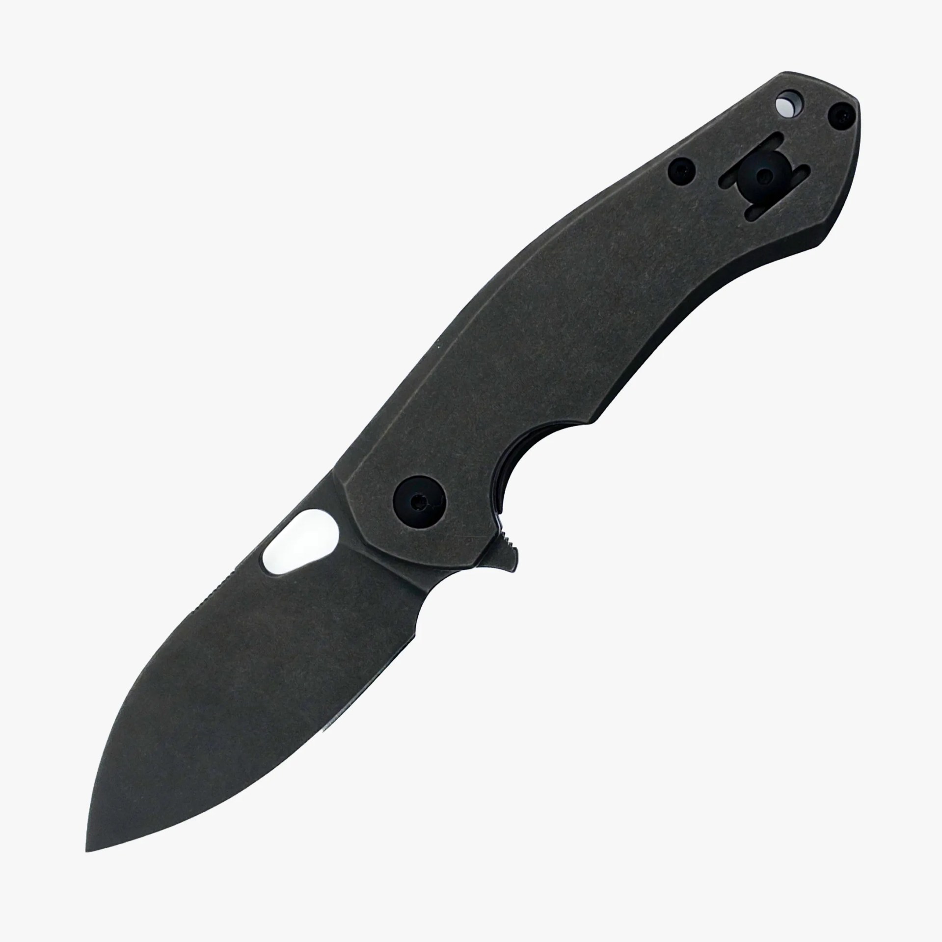 Black folding knife with textured handle and thumb hole on blade.