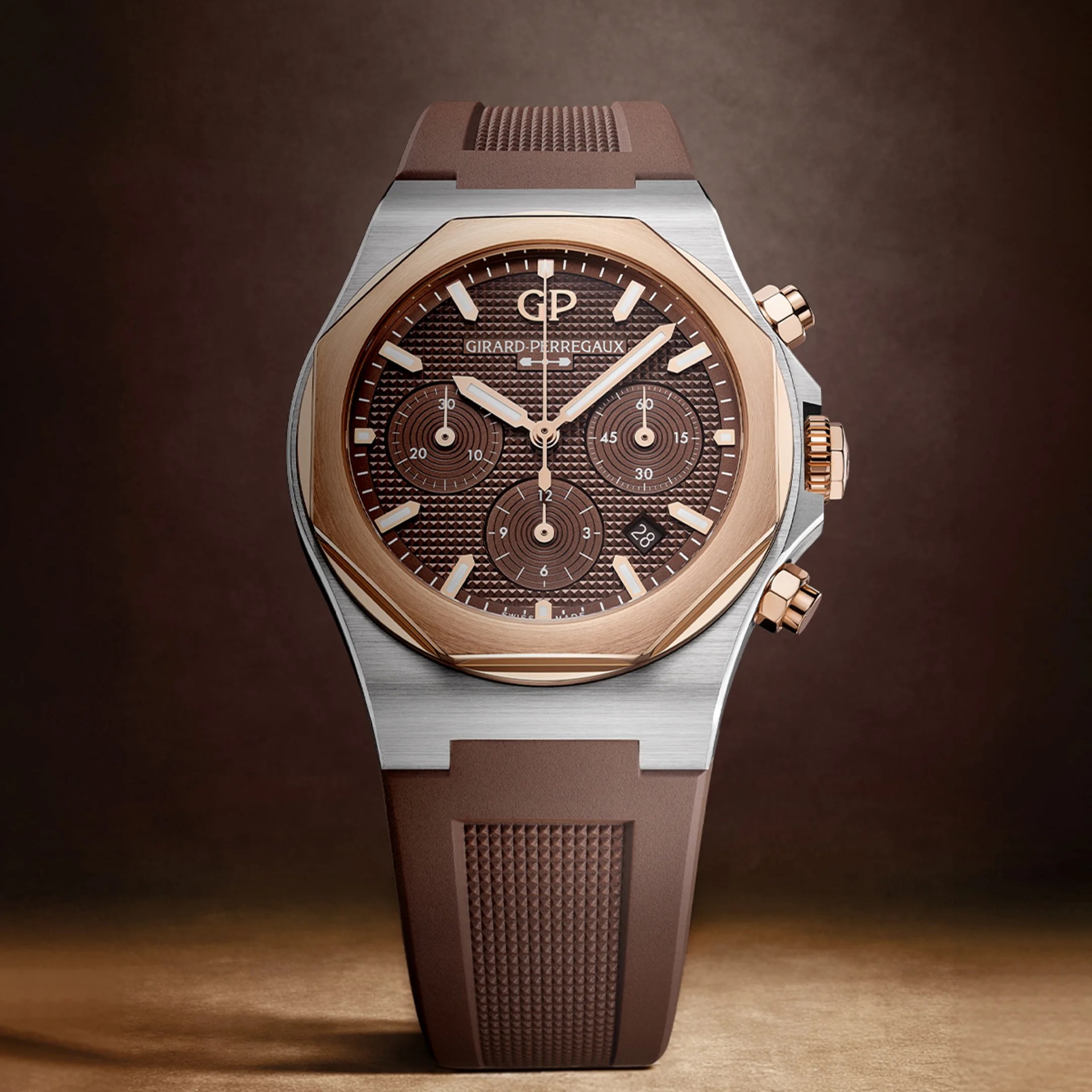 Brown textured dial chronograph watch with rose gold bezel and brown rubber strap.