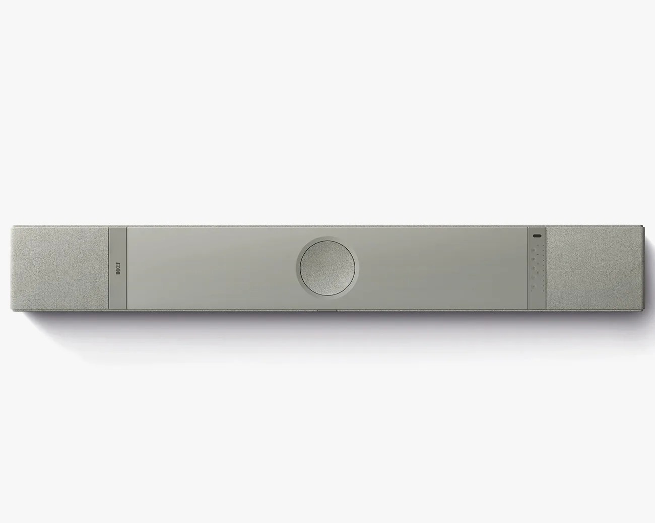 Gray rectangular soundbar with fabric-covered ends and a circular speaker in the center.