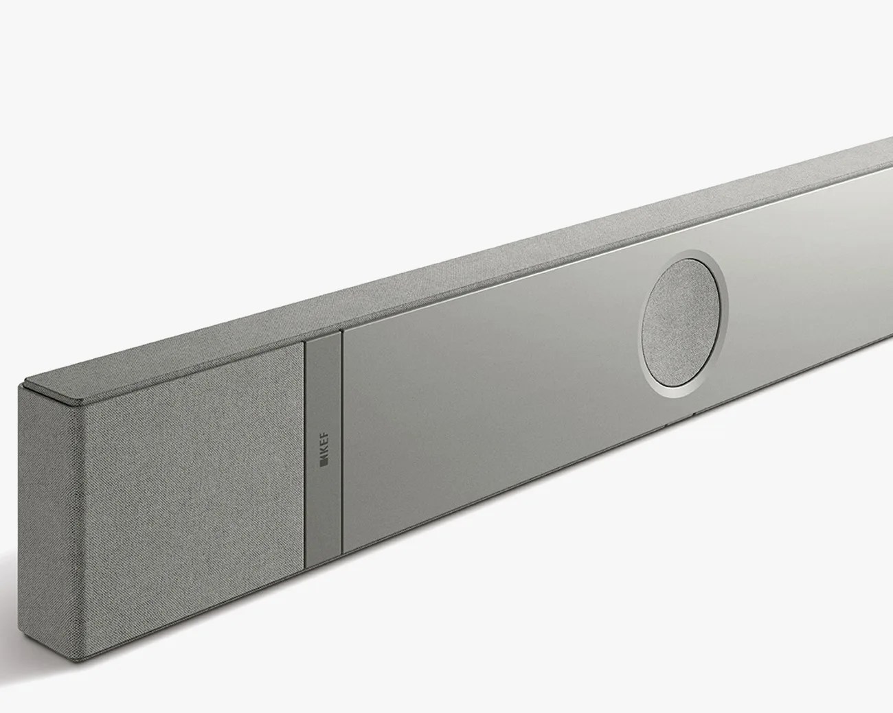 Gray KEF soundbar with fabric-covered speakers and a circular speaker grille on a white background.