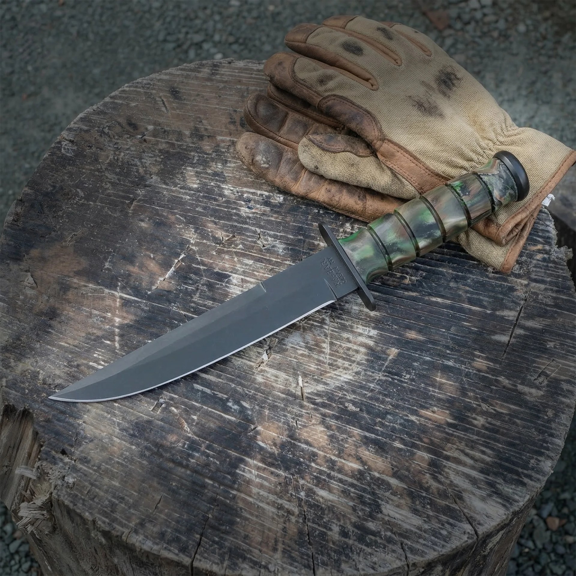 Worn brown and beige work gloves next to a green and black handled knife on a weathered wooden stump.