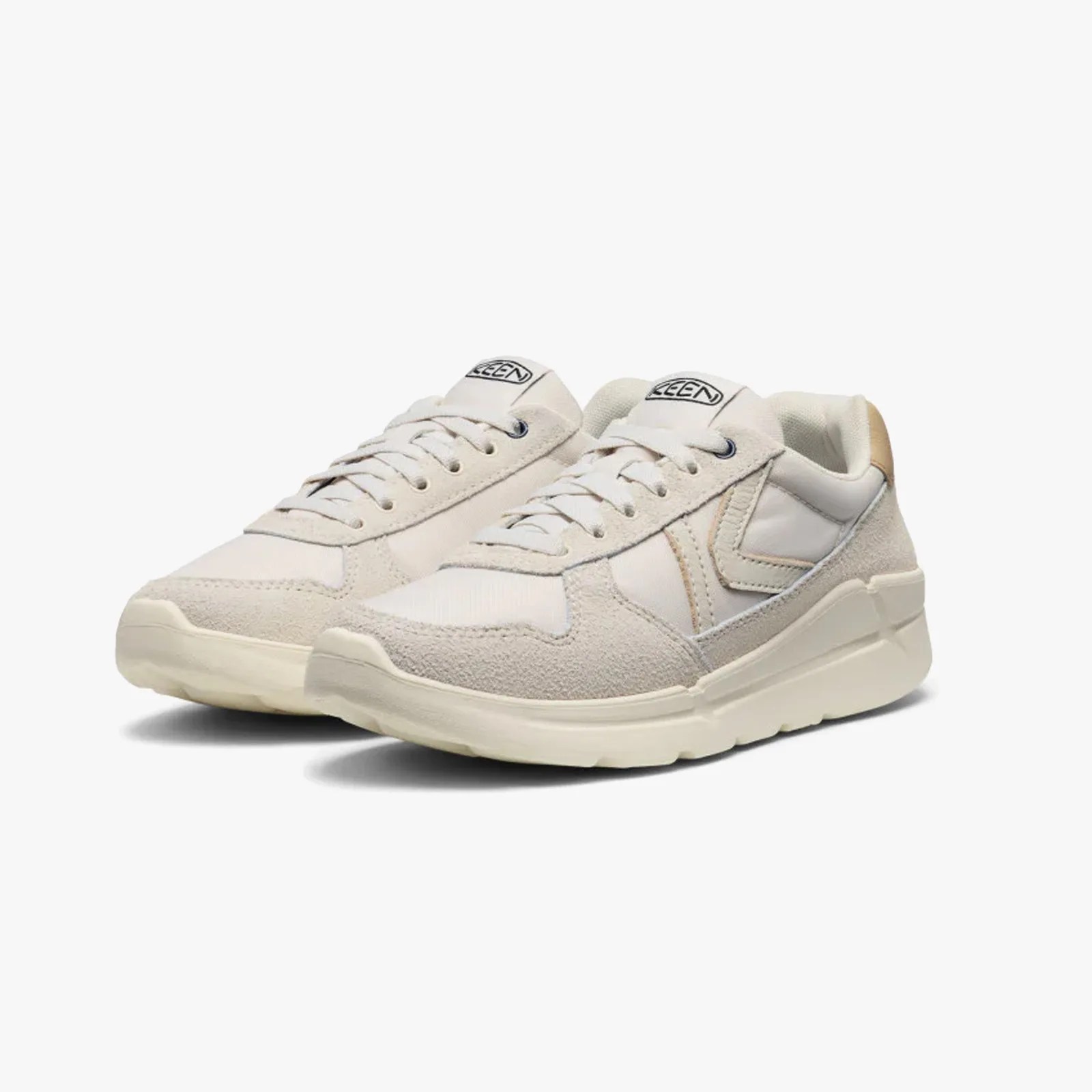 Pair of off-white Keen sneakers with suede and fabric panels, lace-up design, and thick rubber soles.