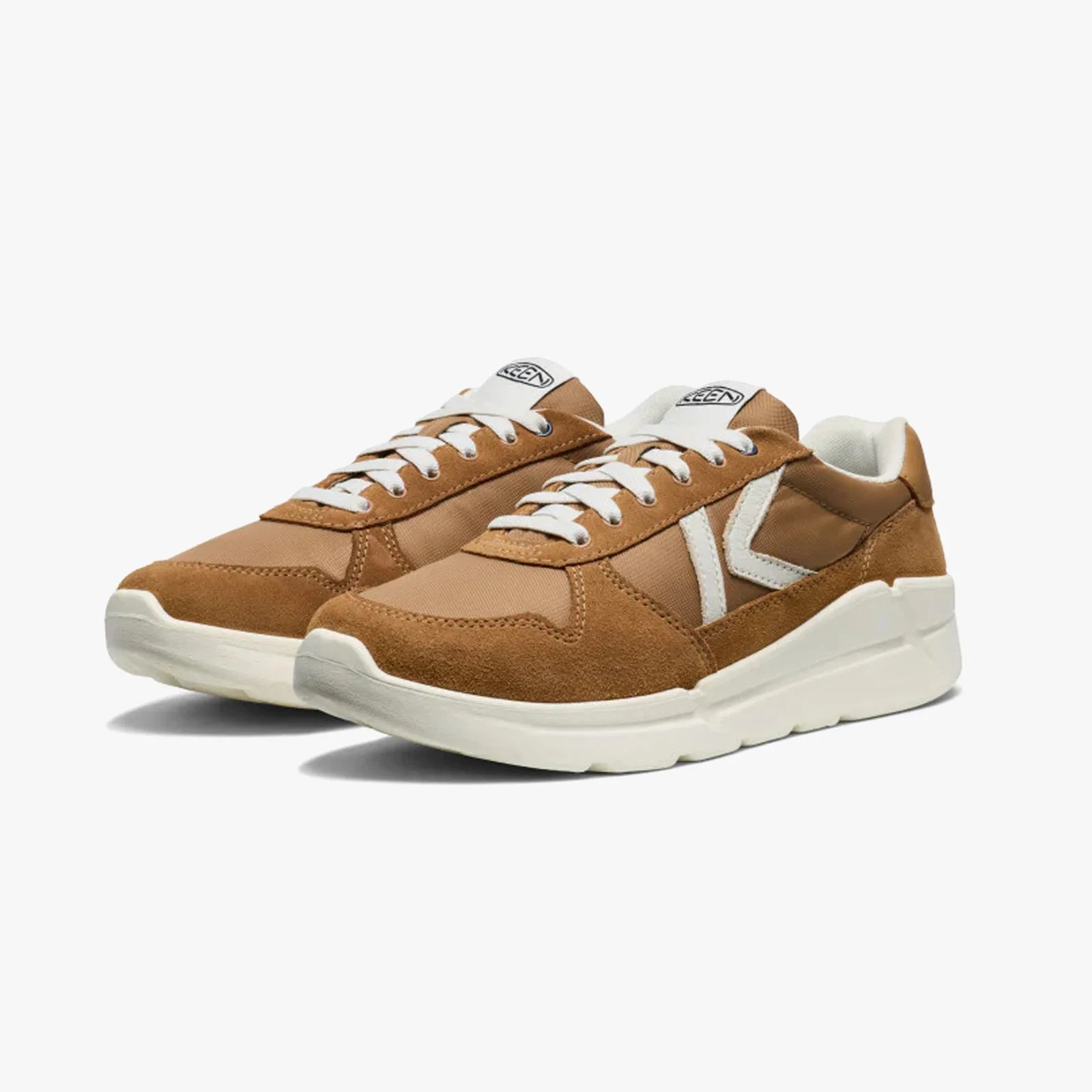 Pair of brown and white KEEN sneakers with white laces and thick white soles.