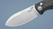 Close-up of a stainless steel MKM Manago-Italy knife blade with a black textured handle and blue accent.