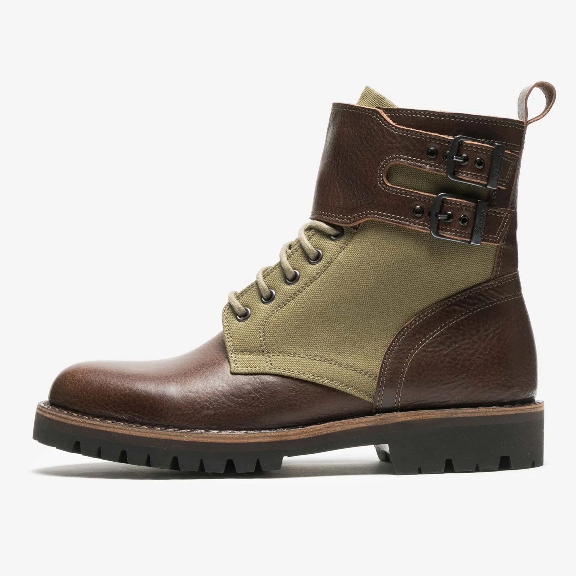 Brown leather and olive green canvas lace-up boot with double buckle straps and black lug sole.