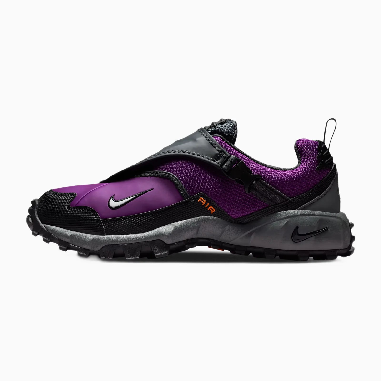 Purple and black Nike trail running shoe with gray sole and orange "AIR" text on the side.
