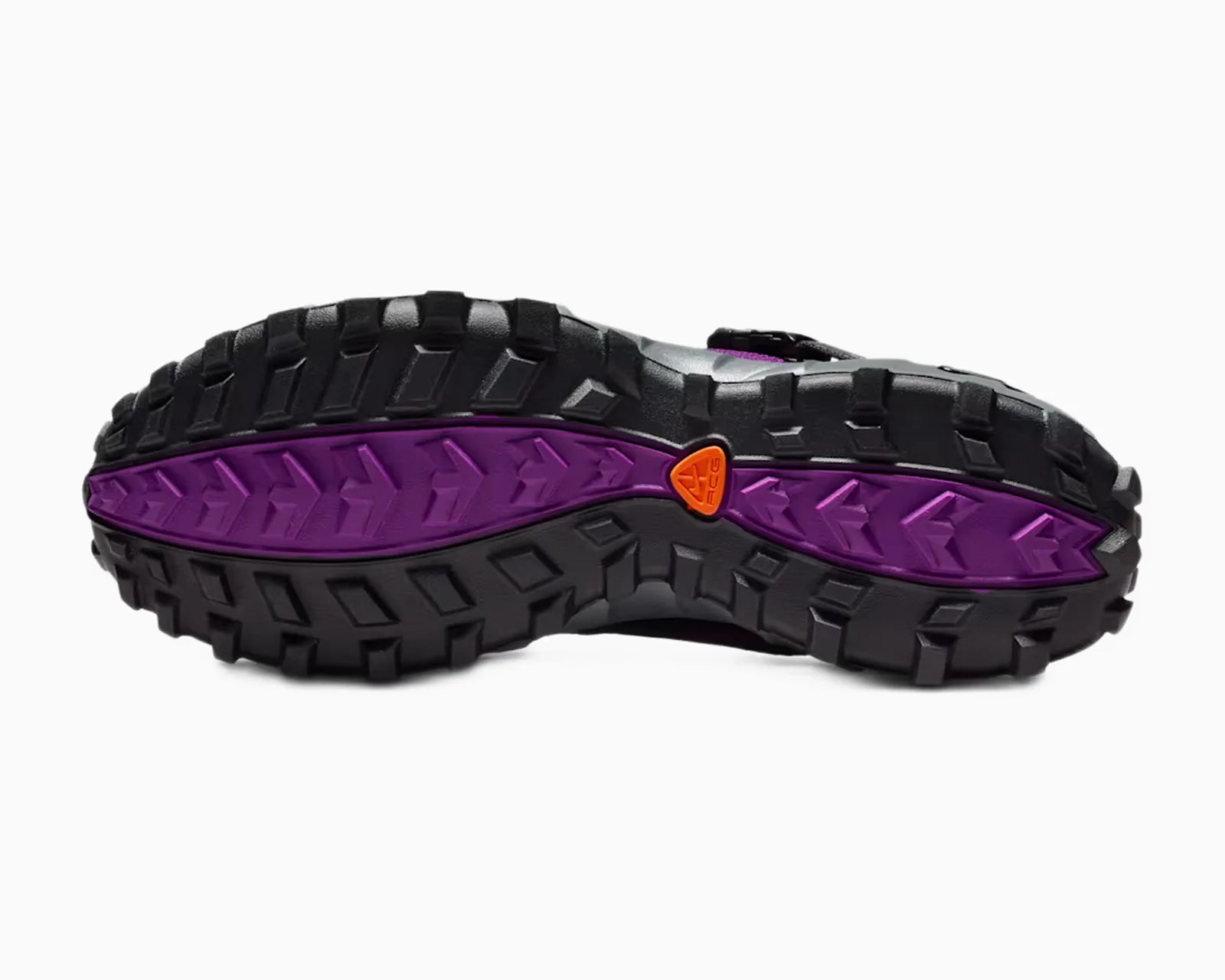 Black and purple rugged shoe sole with deep treads and an orange ACG logo near the center.