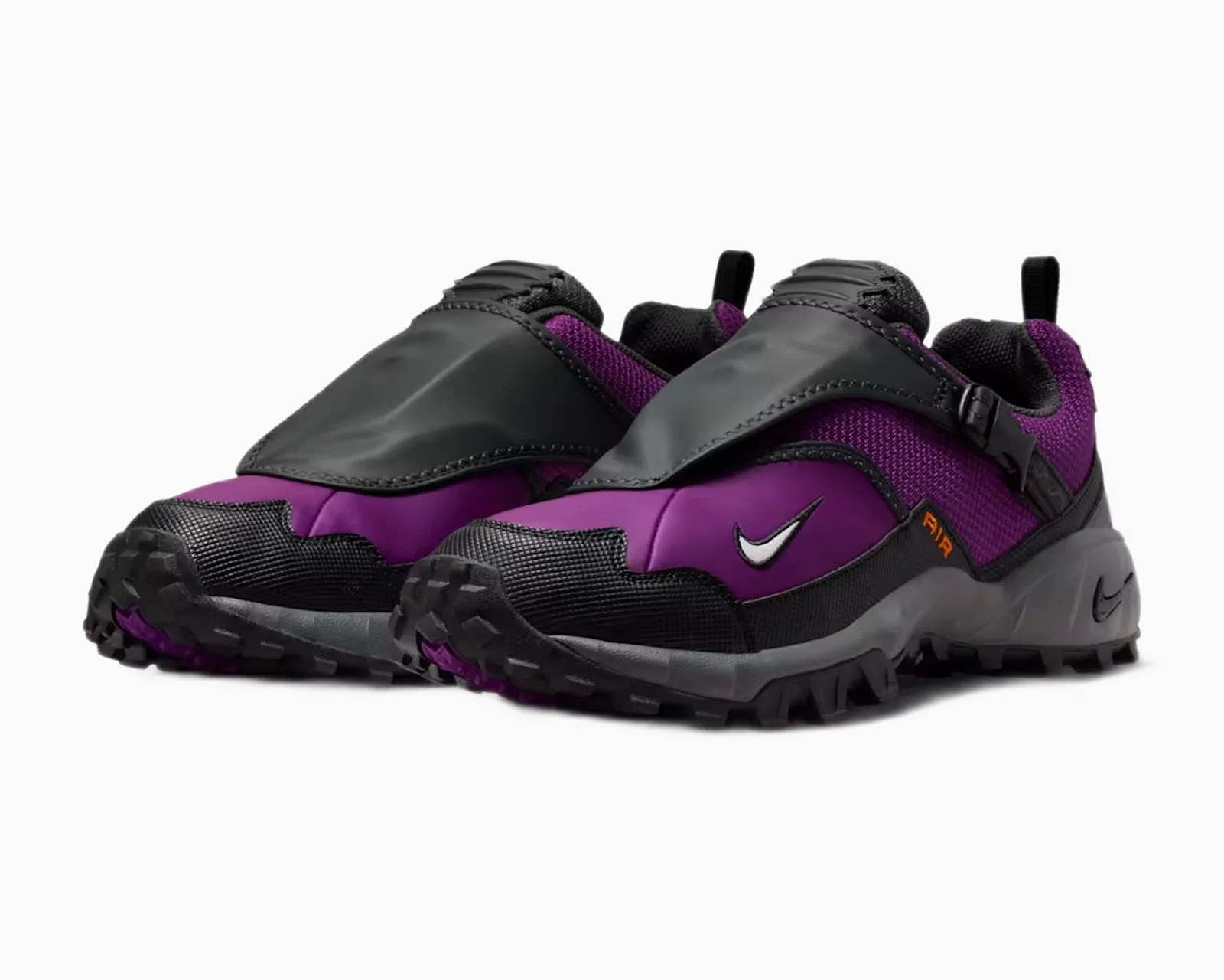 Pair of purple and black Nike trail running shoes with black protective overlays and rugged soles.