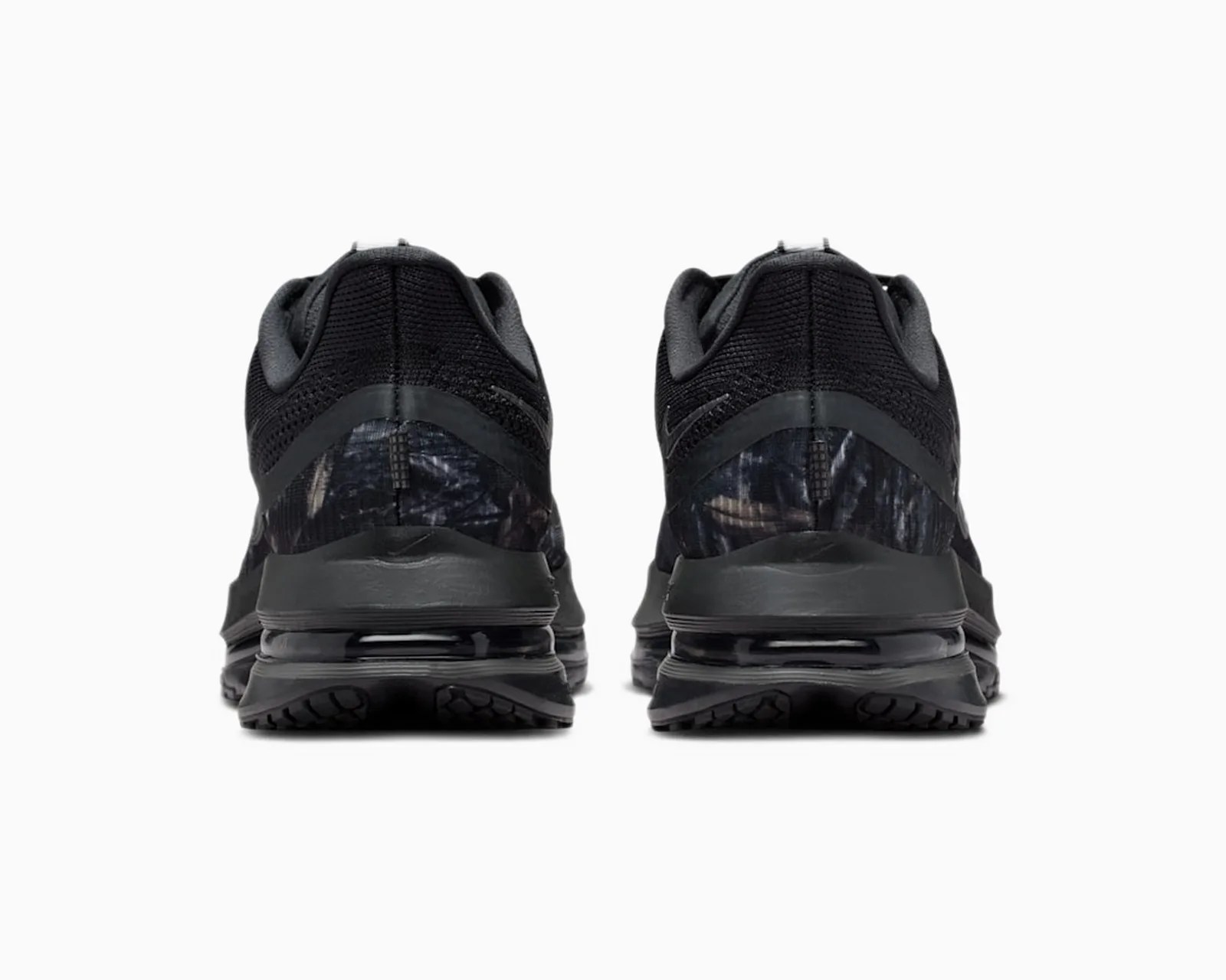 Pair of black athletic shoes with mesh upper and visible air cushioning in the sole, shown from the back.