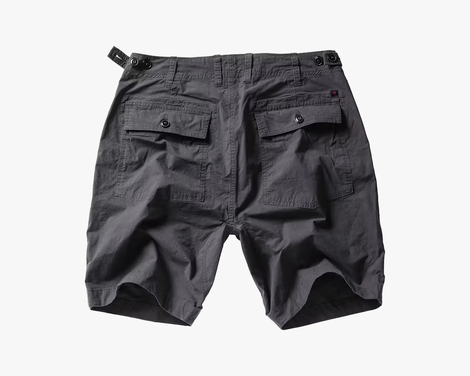 Charcoal gray shorts with buttoned flap back pockets and adjustable side tabs.