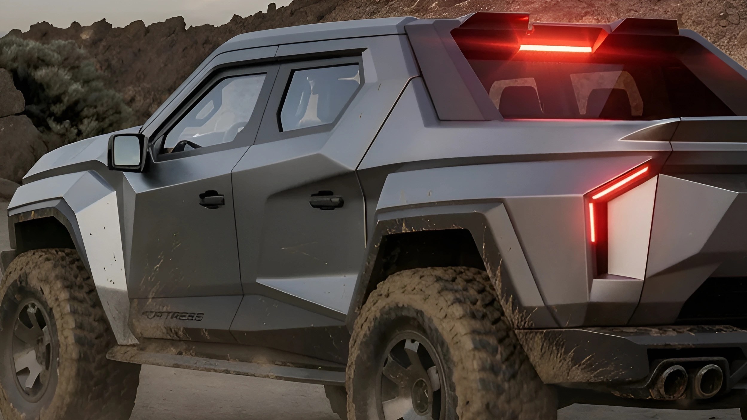 Matte gray off-road truck with angular design and illuminated red rear lights on a dirt road.