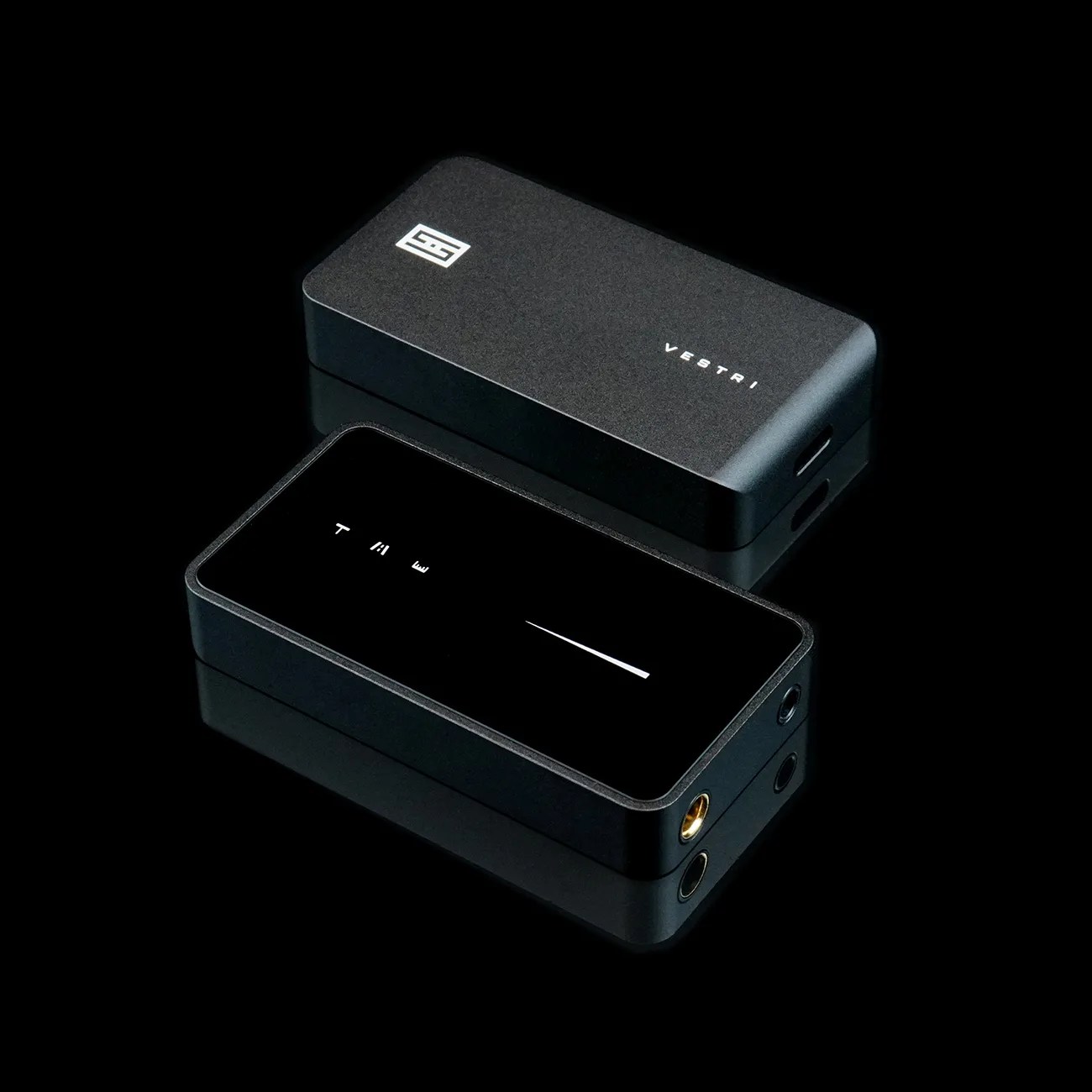 Two black rectangular electronic devices with Vestri branding, one showing a volume bar and the other with a USB-C port.