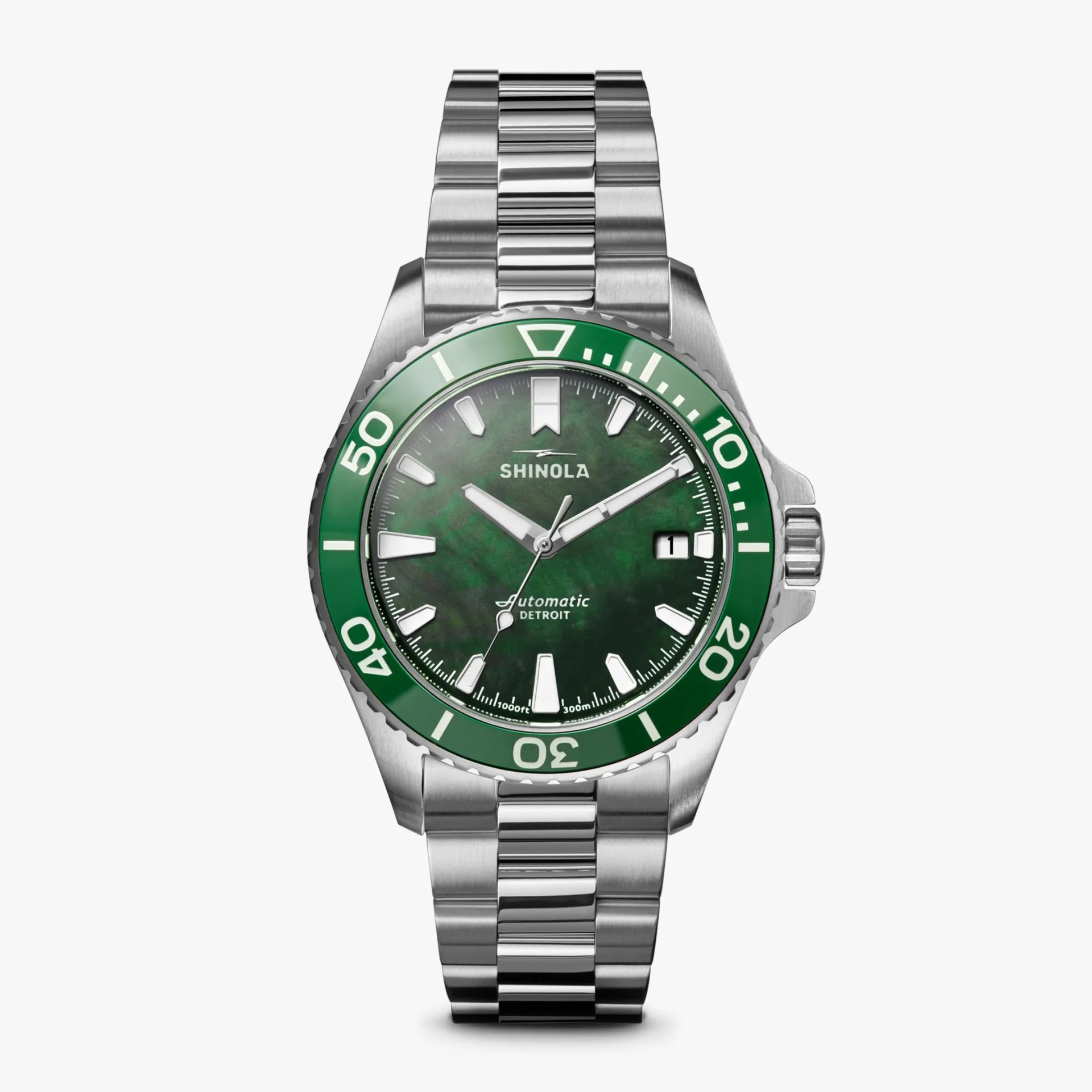 Stainless steel wristwatch with green bezel and dial, white markers, and date window at 3 o'clock.