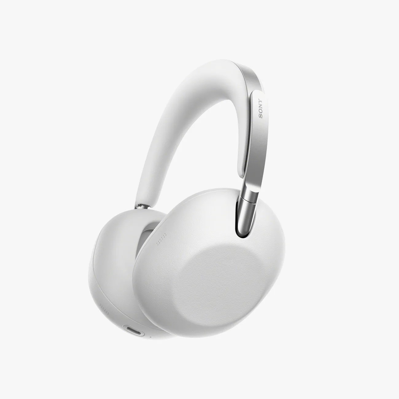 White over-ear Sony headphones with silver metal accents and cushioned ear cups.