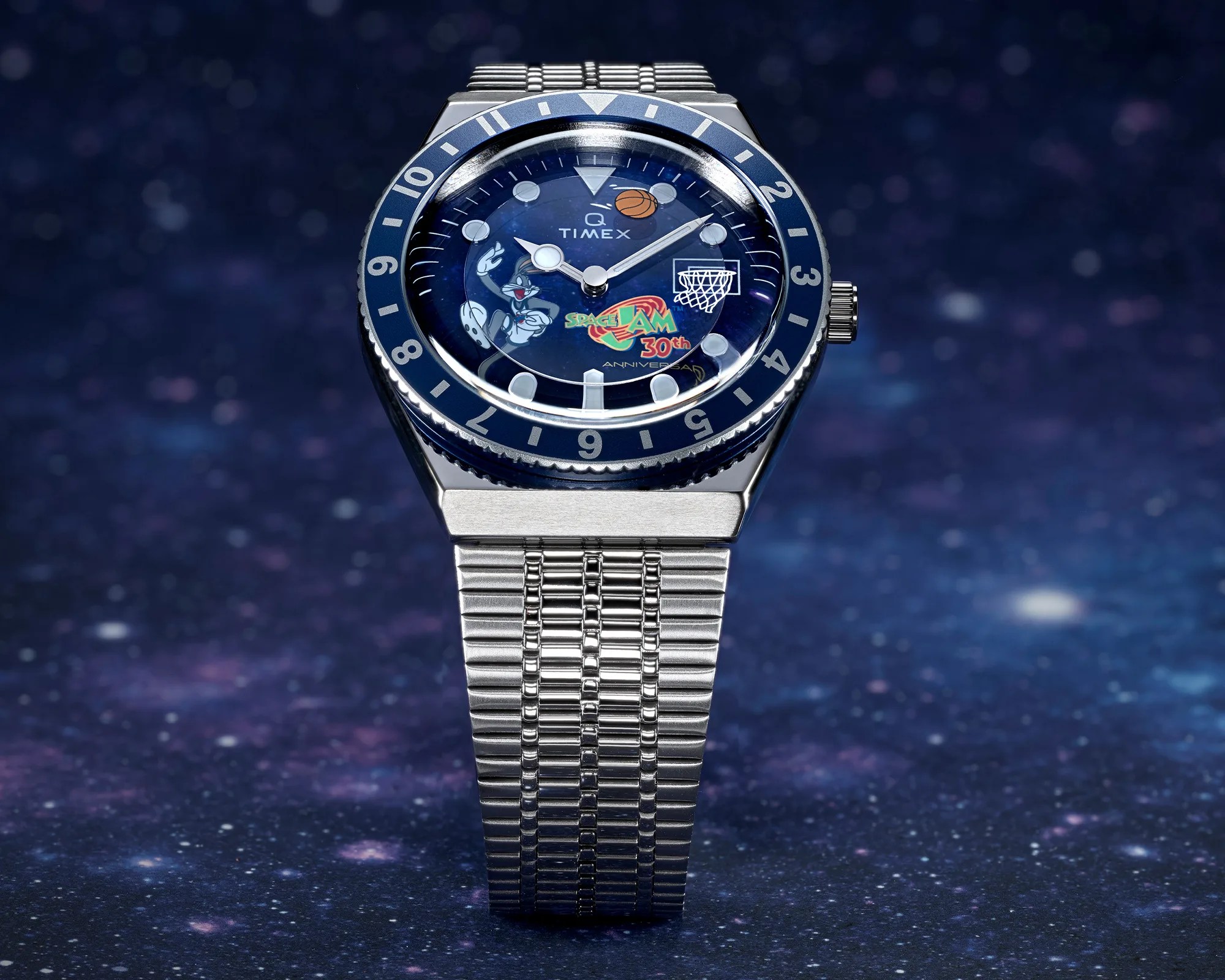 Silver metal wristwatch with a blue bezel and a Space Jam 30th Anniversary dial featuring Bugs Bunny and a basketball hoop.