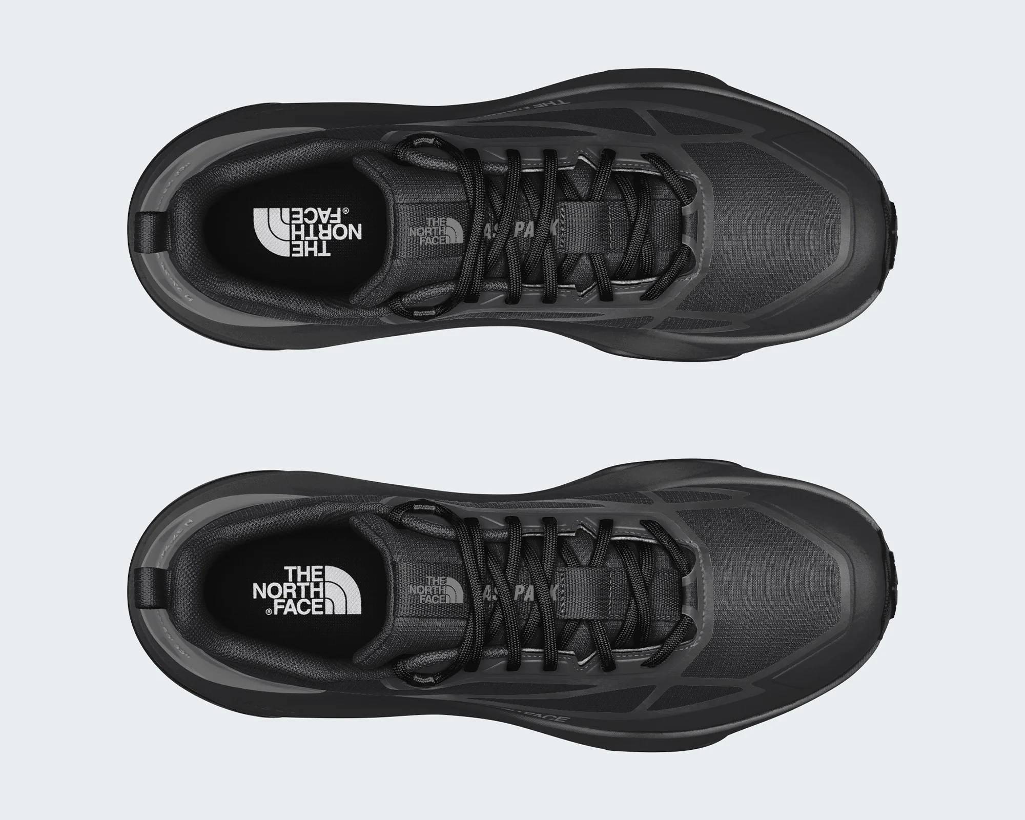 Top view of black The North Face hiking shoes with black laces and padded collars.