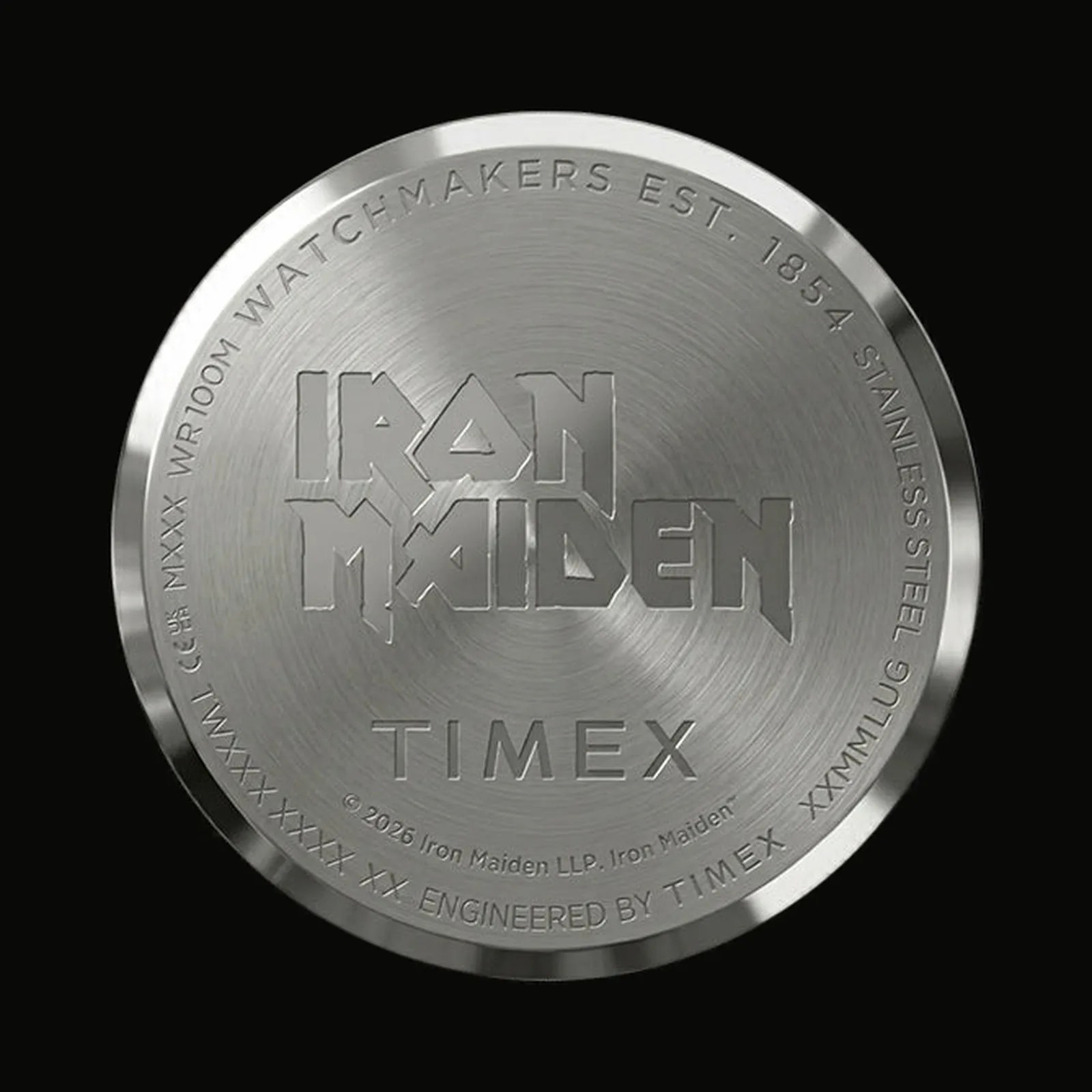 Brushed stainless steel watch back engraved with "Iron Maiden," "Timex," and watch specifications.
