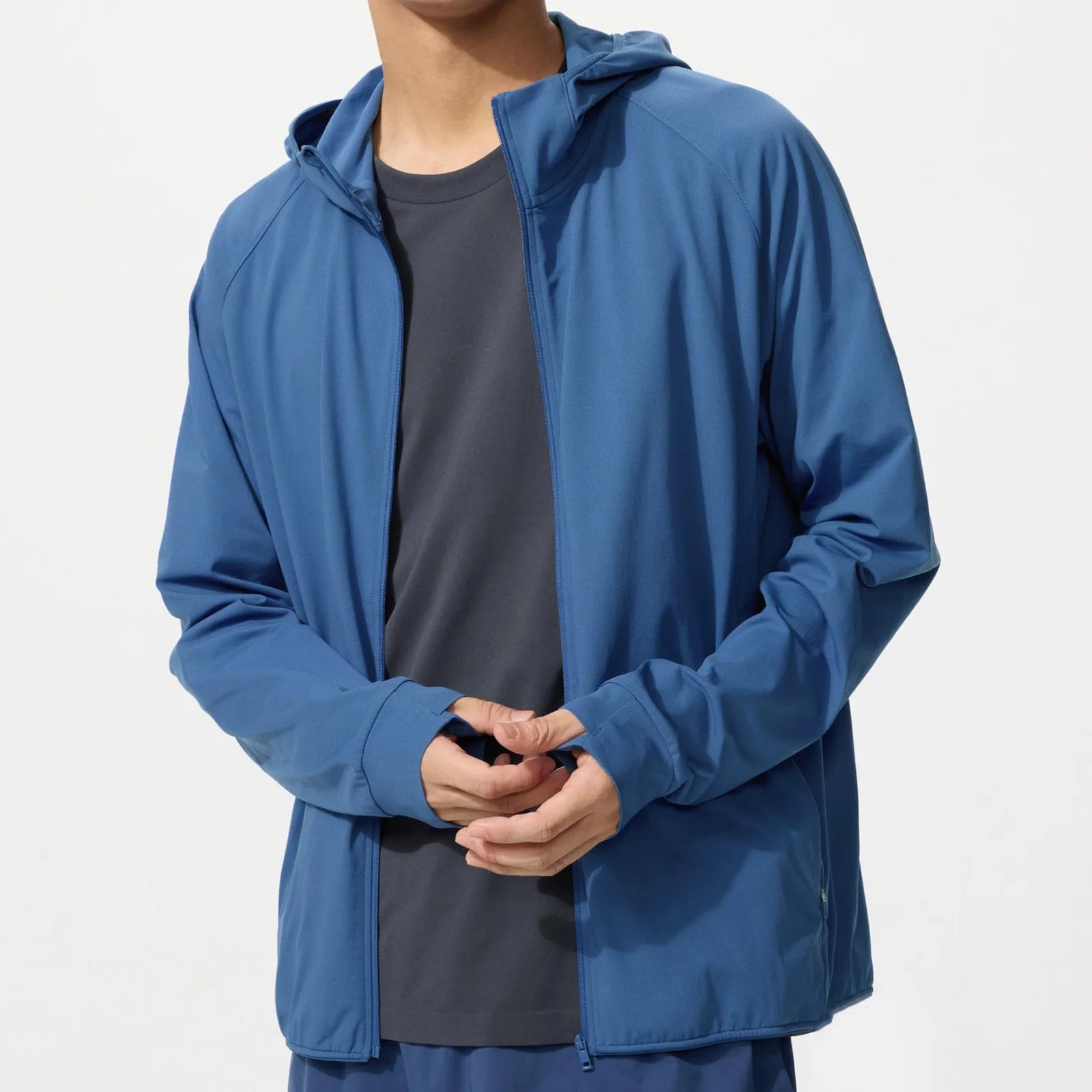 Blue zip-up hooded jacket worn over a dark gray crew neck t-shirt.