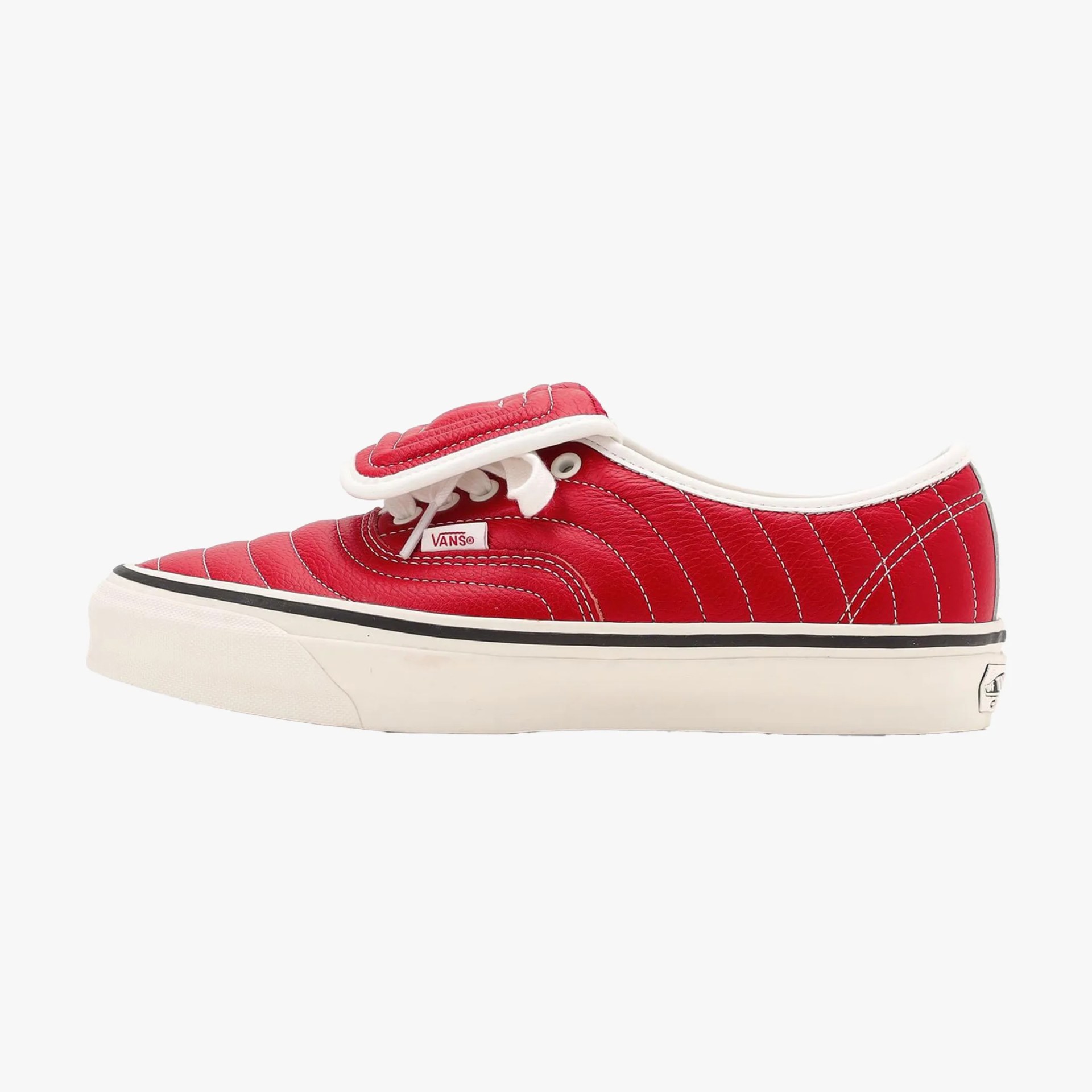 Red Vans sneaker with white stitching, white laces, and a white rubber sole with a black stripe.