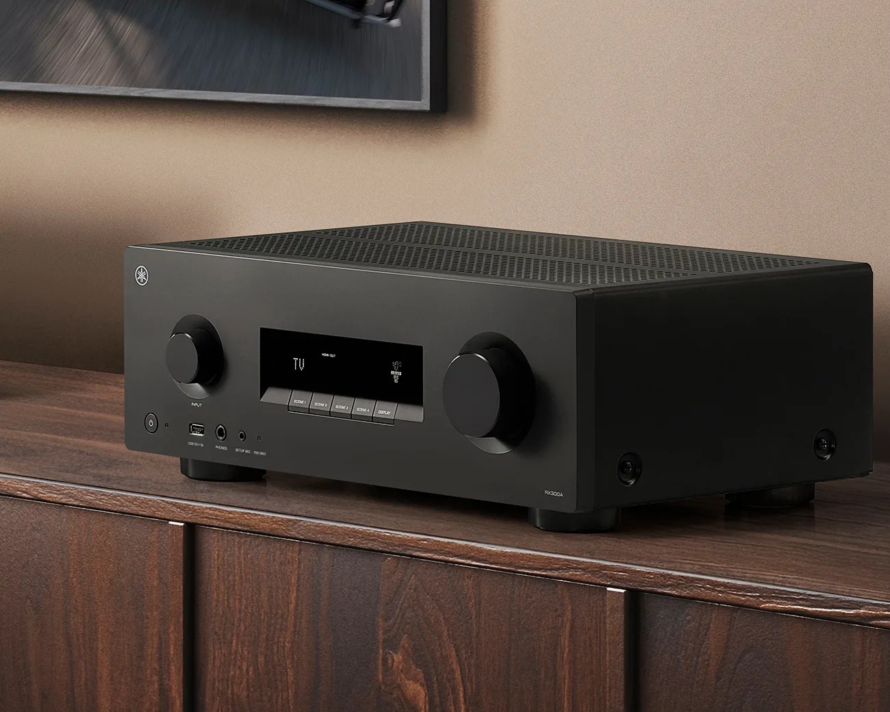 Black Yamaha RX300A AV receiver with knobs and display screen on a wooden cabinet.