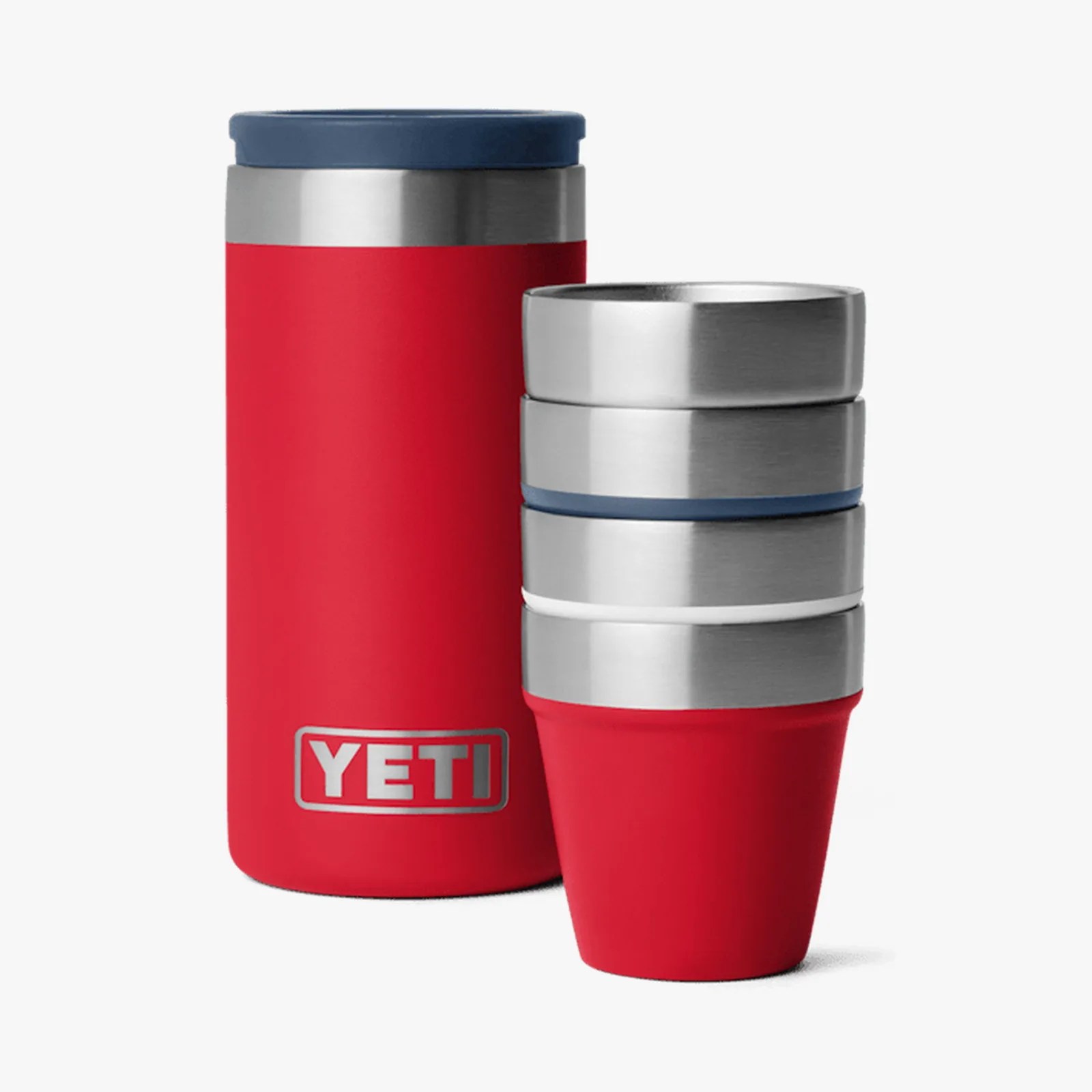 Red YETI insulated tumbler with blue lid and four stacked stainless steel cups with red silicone sleeves.