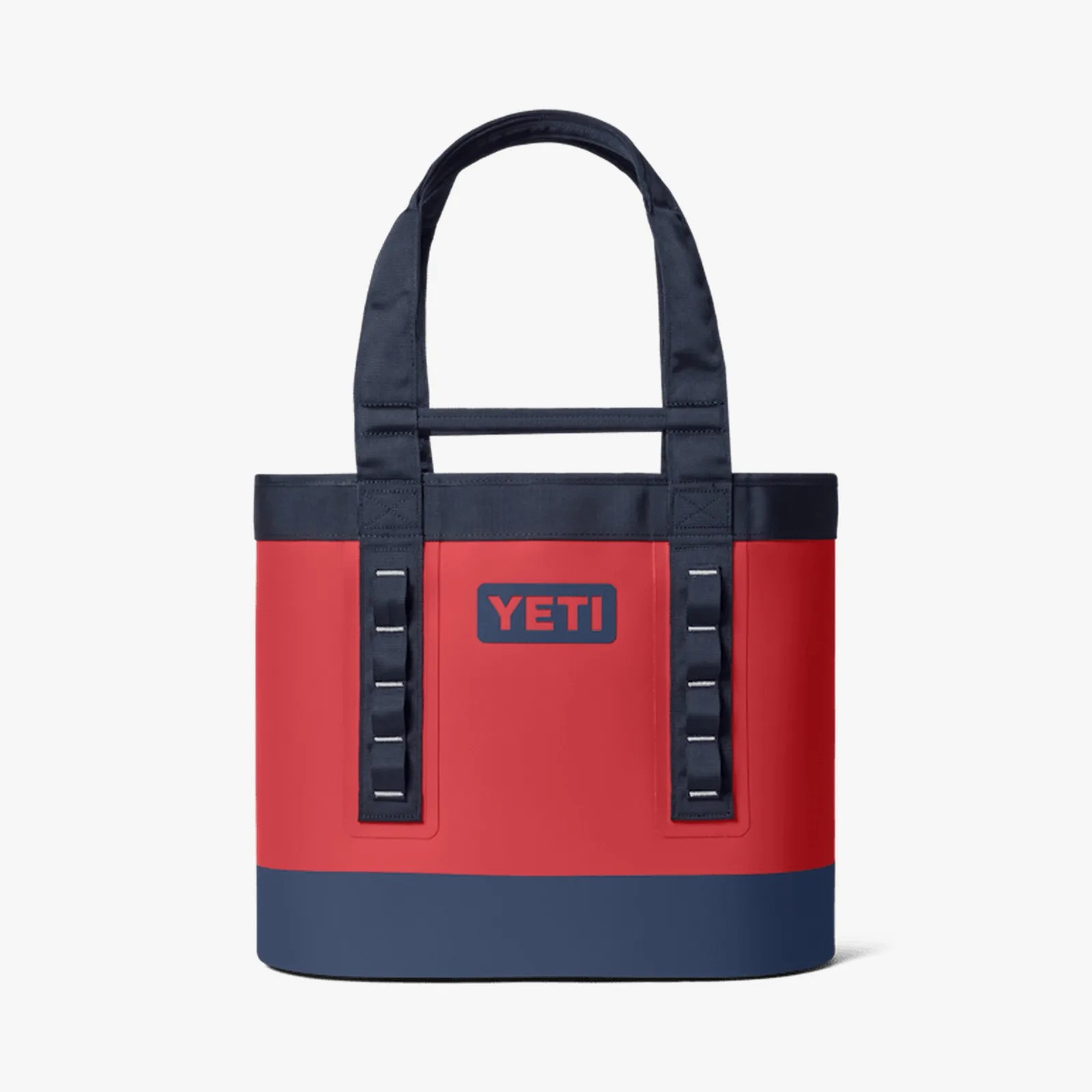 Red and navy YETI tote bag with black handles and logo on a white background.