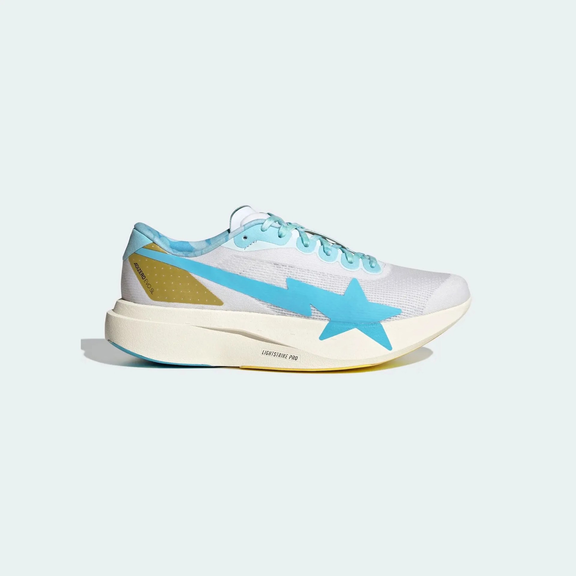 White and light blue running shoe with a large blue star logo and yellow heel accent on a white sole.